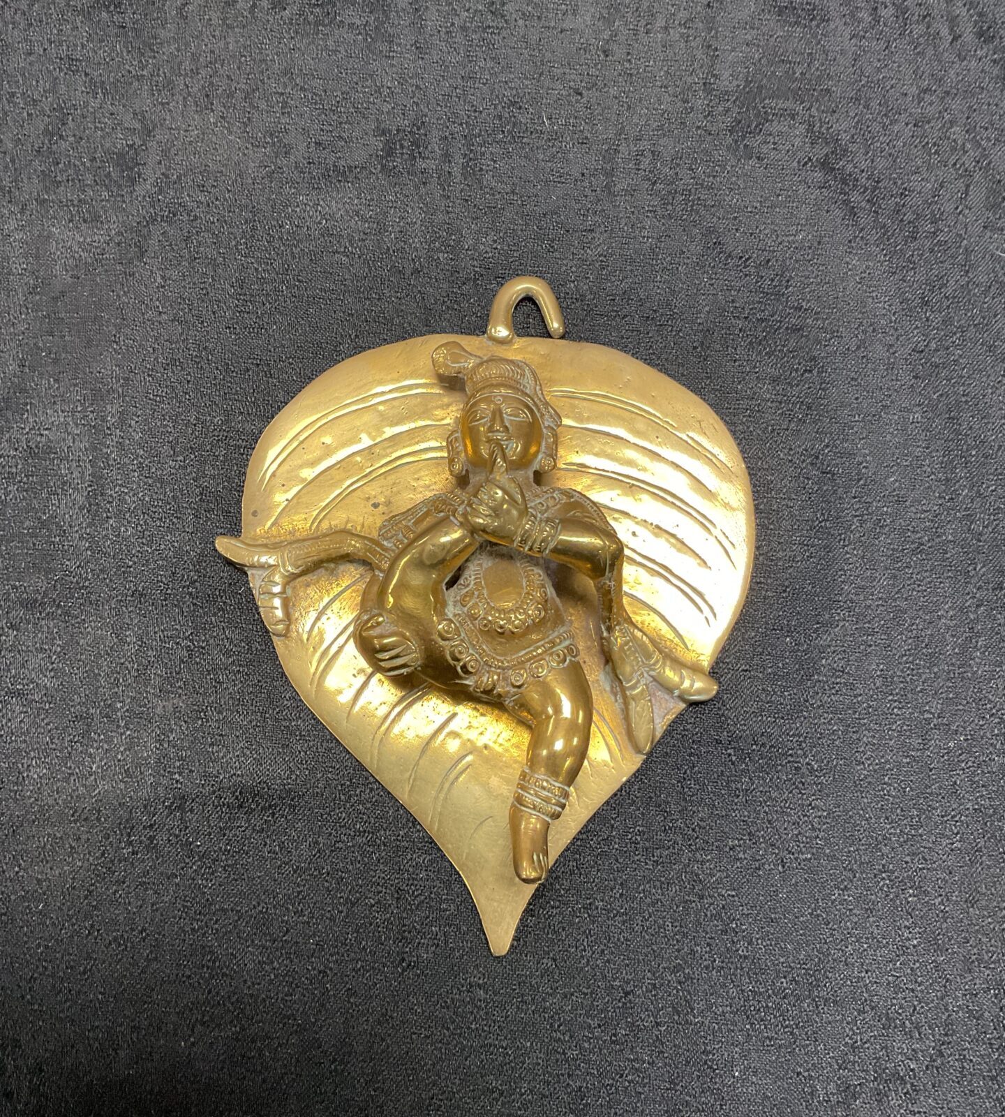 Indian Brass bal krishna sitting on leaf