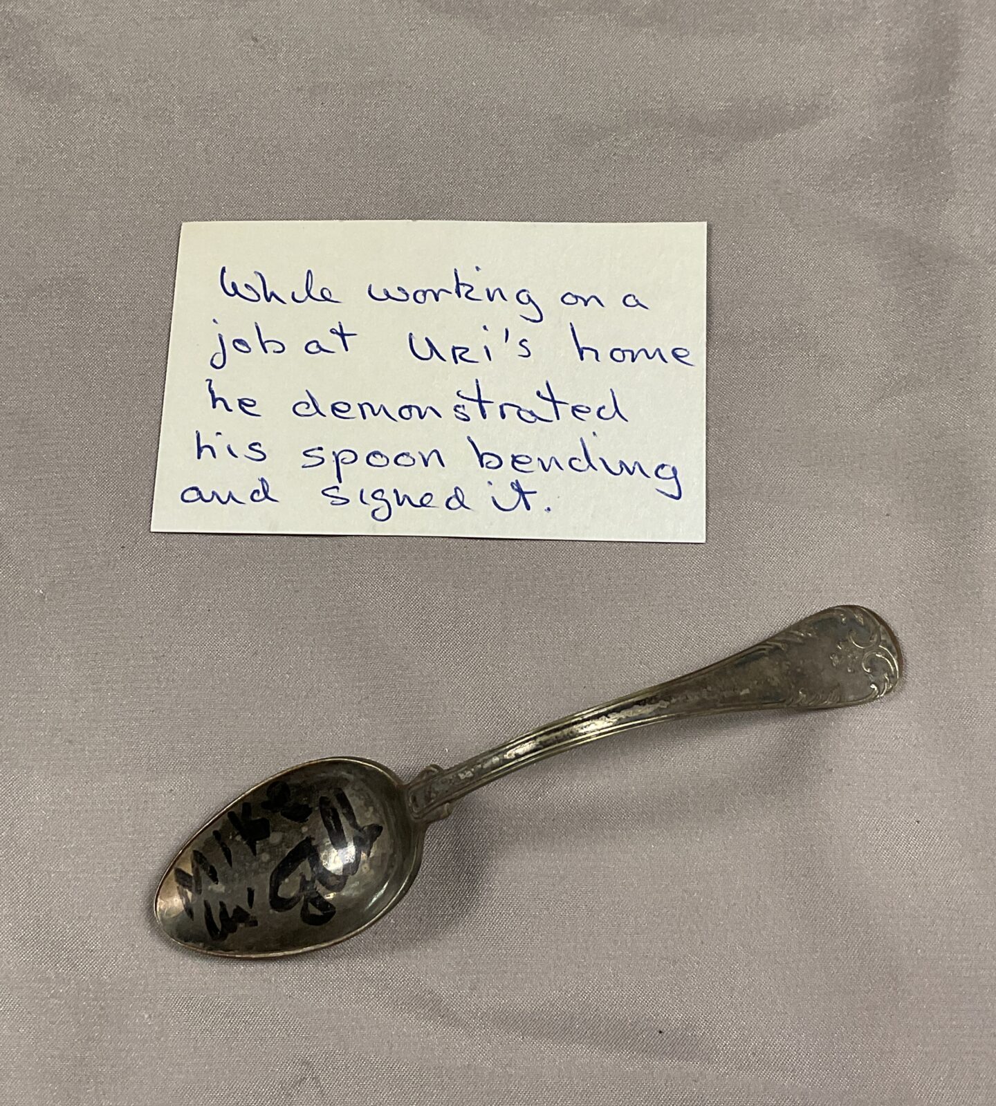 Spoon bent and signed by uri geller