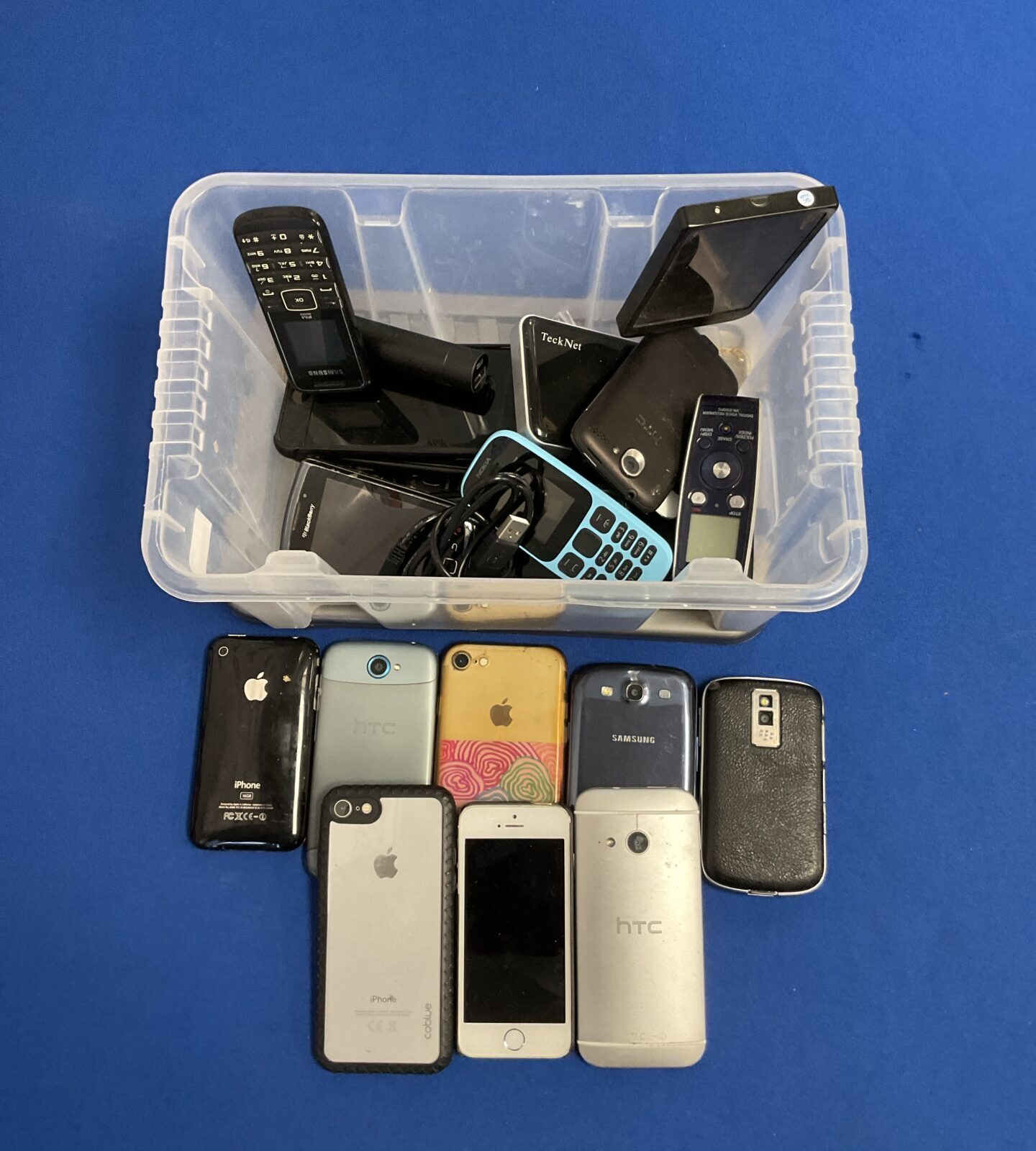 Box of mobile phones including apple iphones