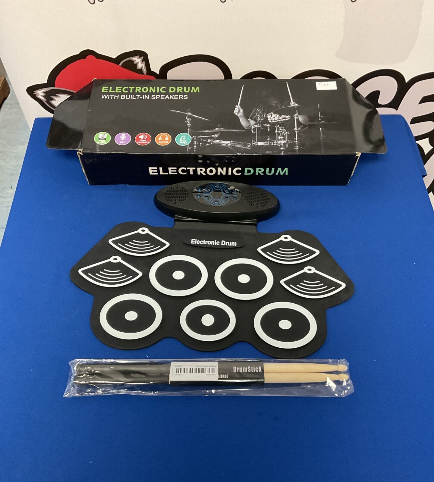 Electronic drum kit with built in speakers