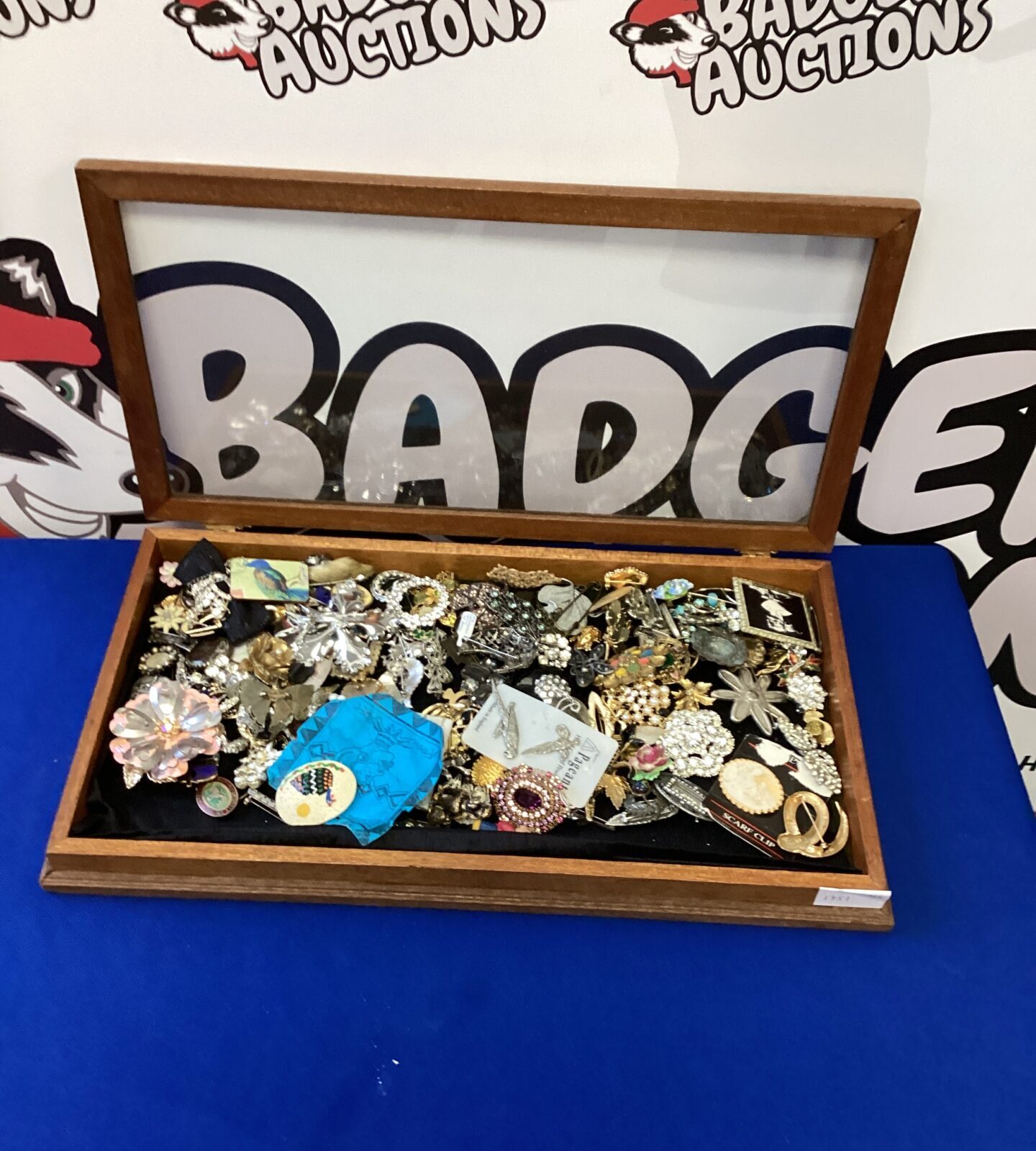 Wooden box full of costume jewellery