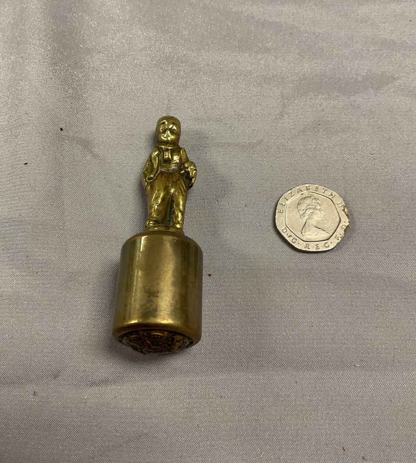 Brass figure poss Pipe tamper or seal.???