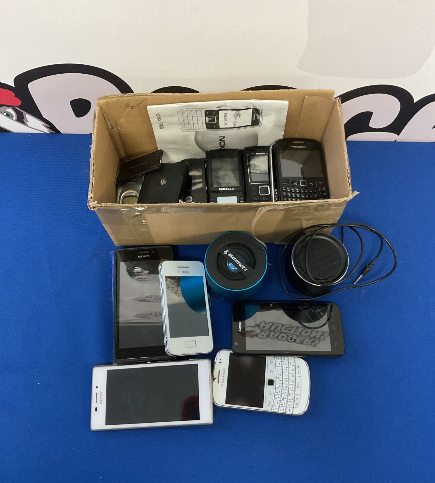 Box of mobile phones & Bluetooth speakers inc sony