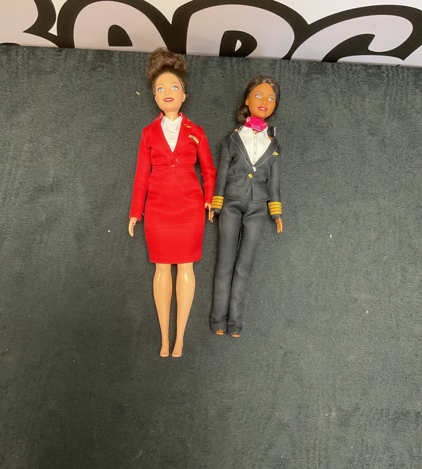 Two virgin airlines barbie dolls