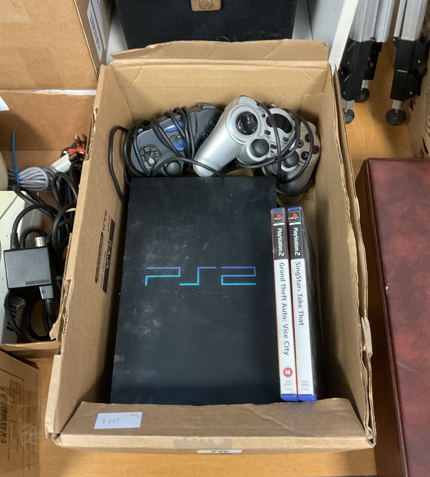 Sony PlayStation 2 console with controllers & games