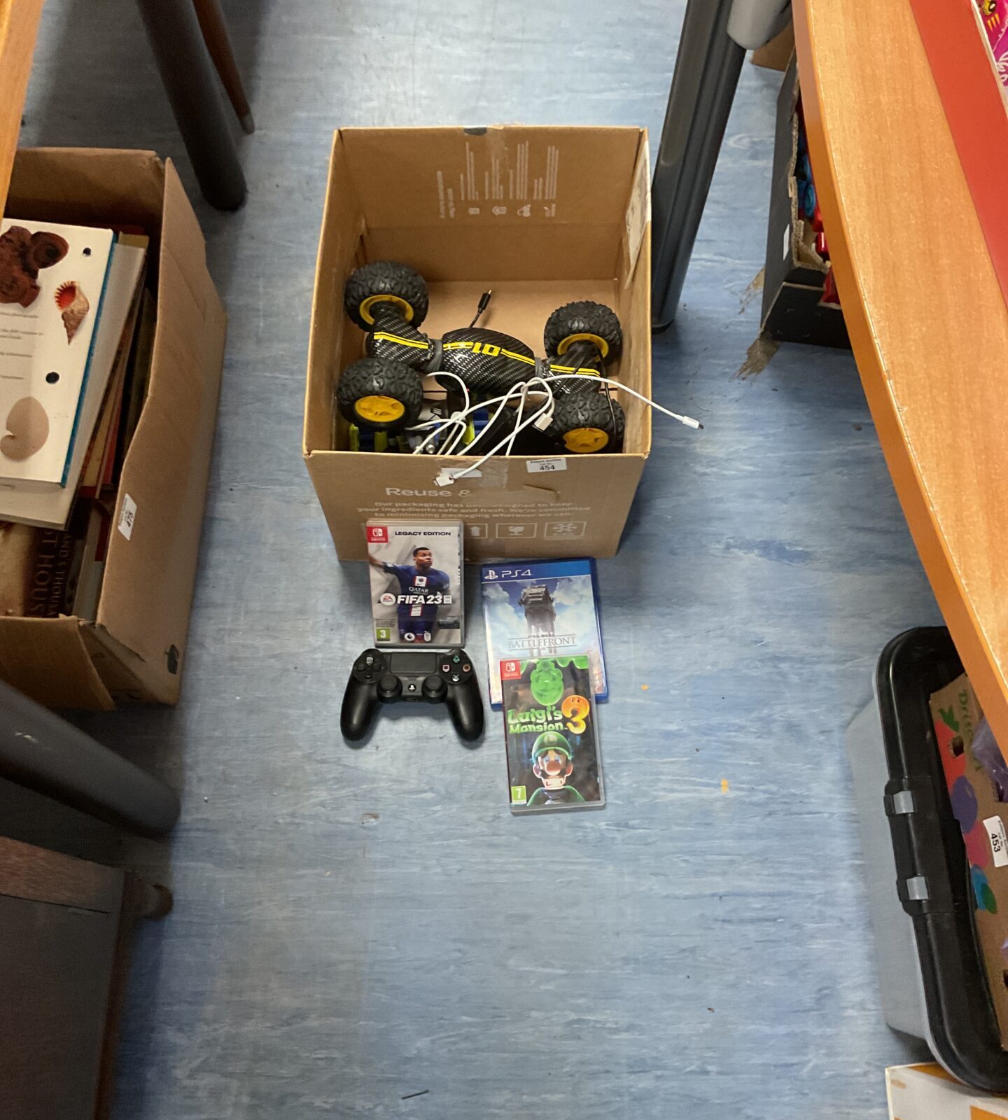 Box of 01 rc car and gaming items inc nintendo and ps4 games inc controller