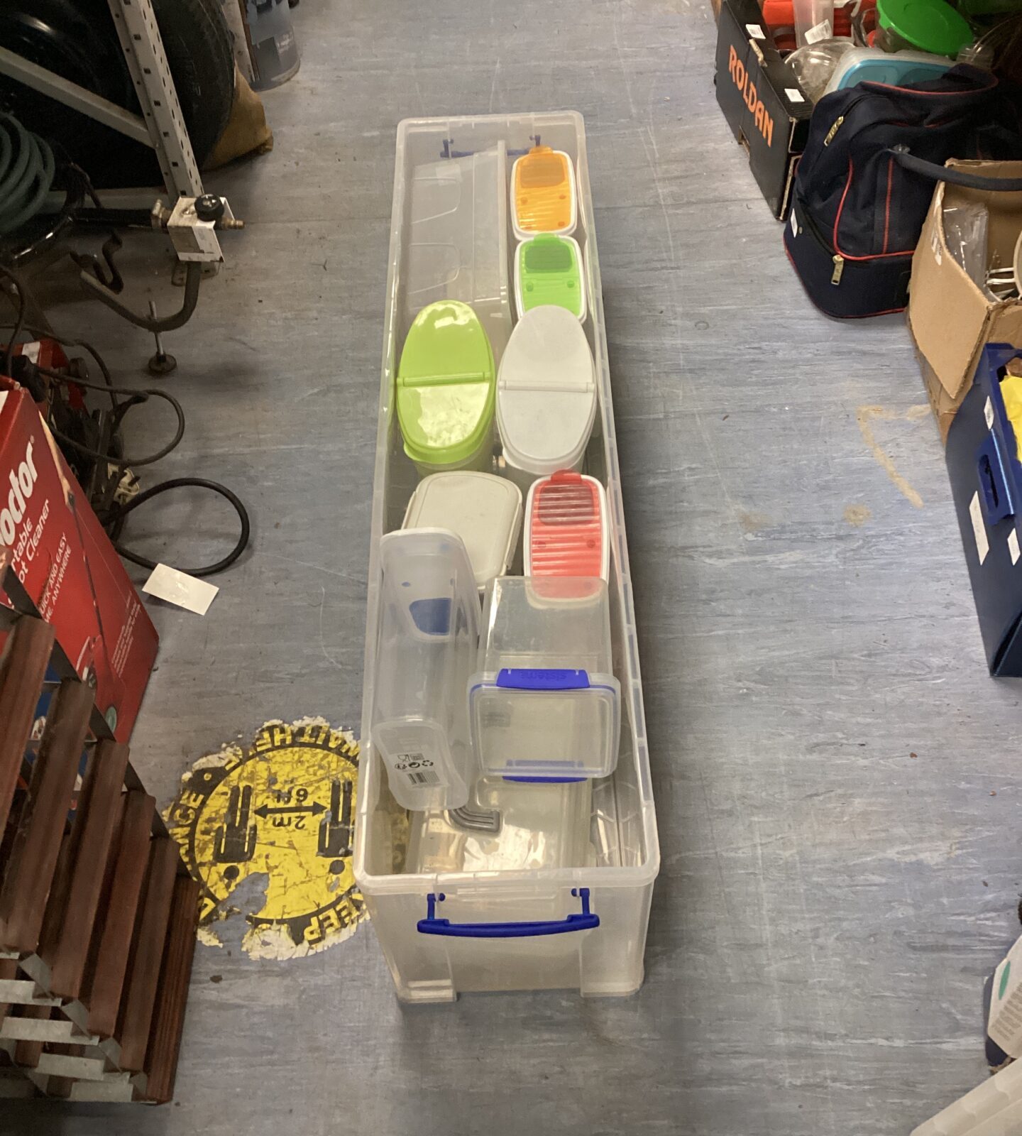 Large rectangular storage box with quantity of Tupperware style tubs