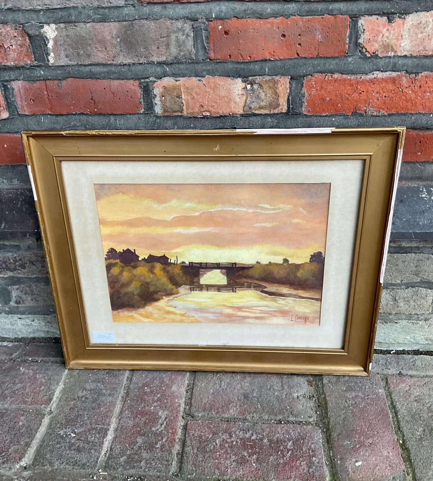 Gilt frmed watercolor of a river scene at sunset signed l collridge