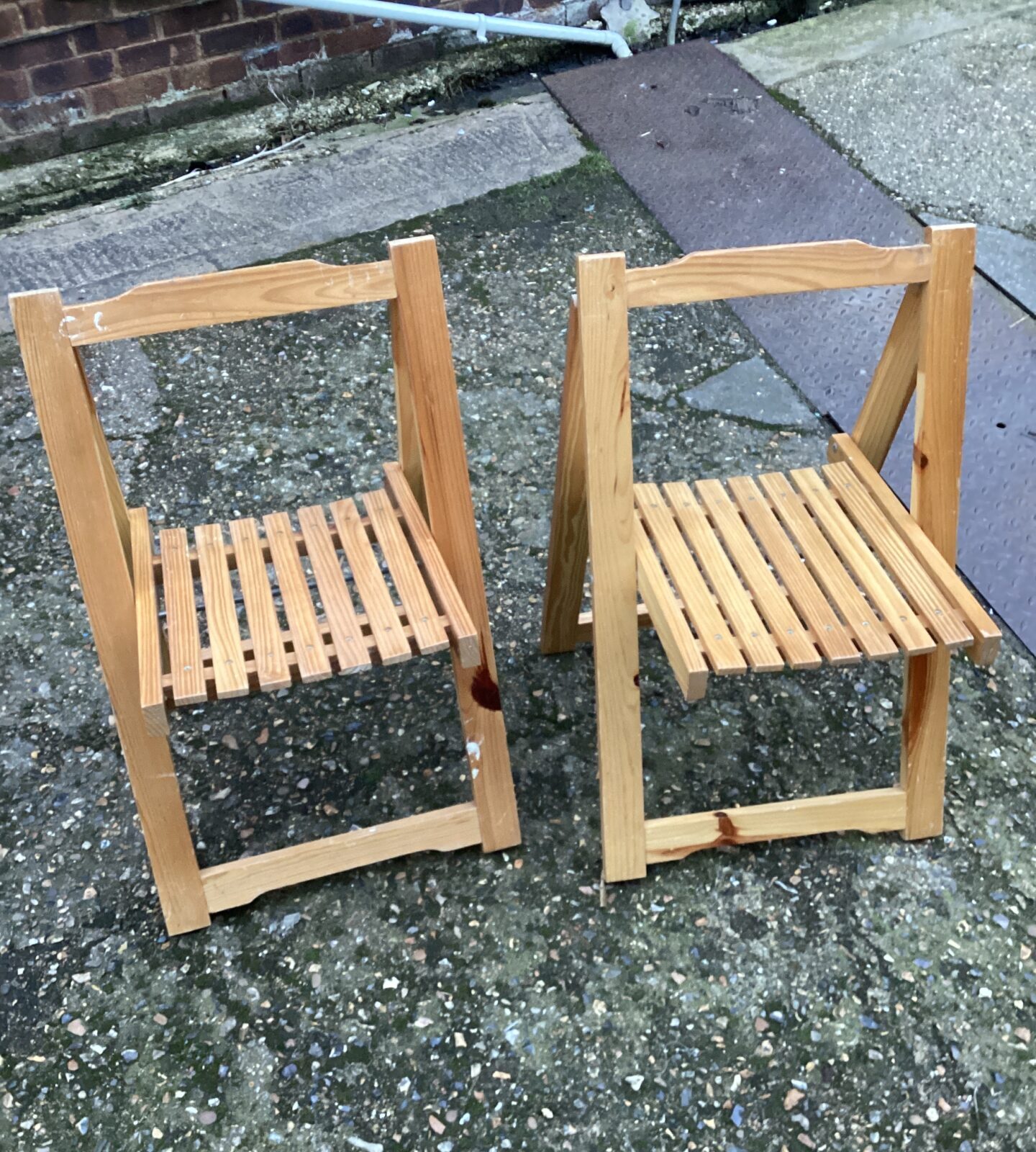 Two wooden folding chairs