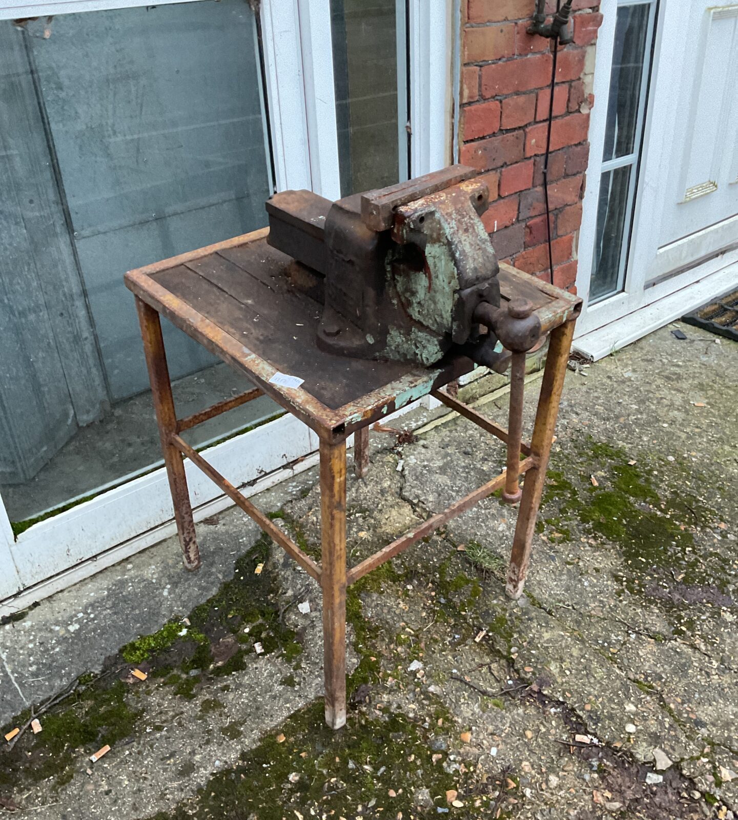 Large ortis steel bench vice on table