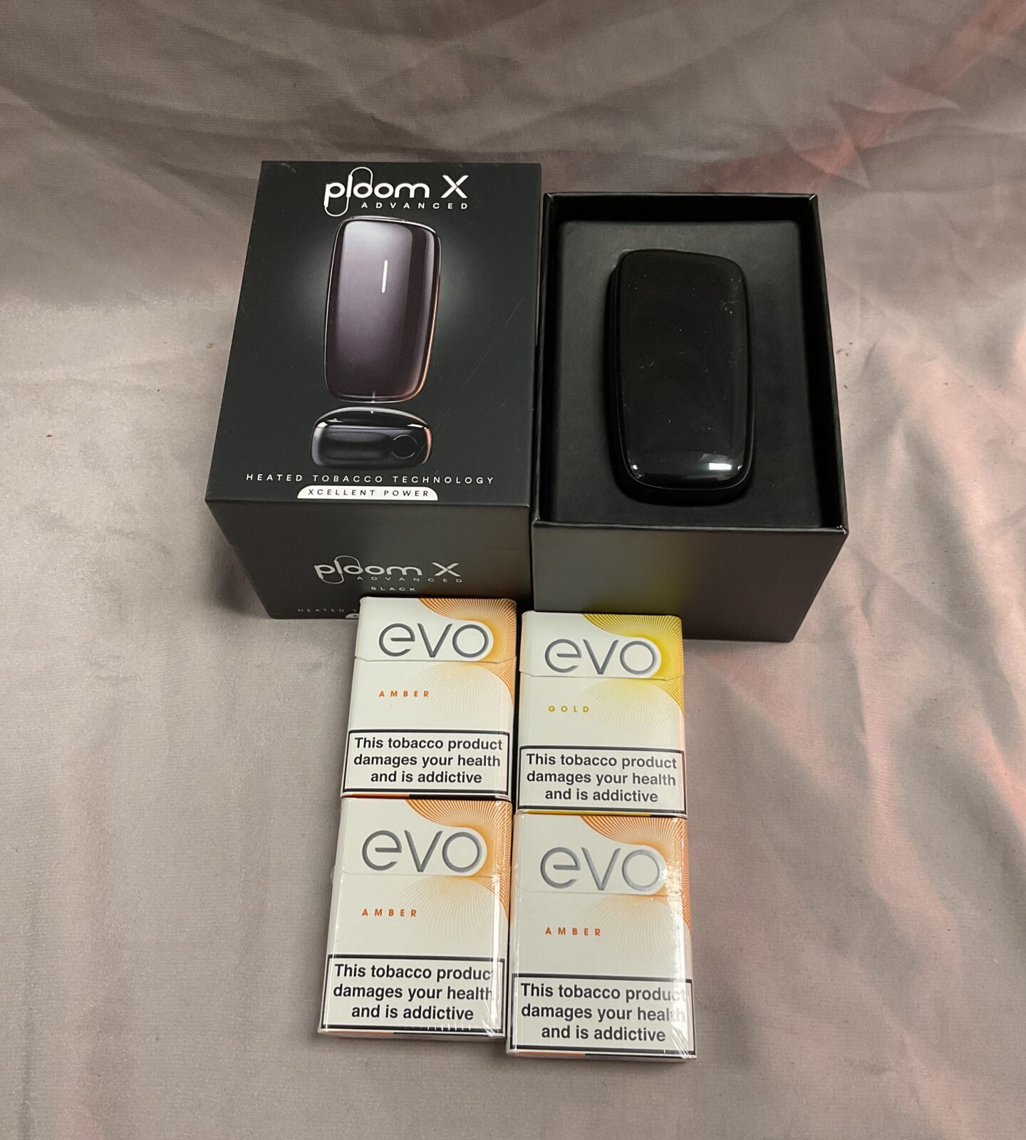 Ploom x heated tobacco technology and four packs of evo tobacco