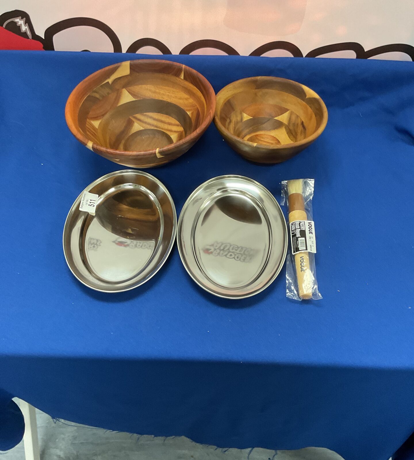 Two wooden bowls, two stainless steel dishes and pastry brush