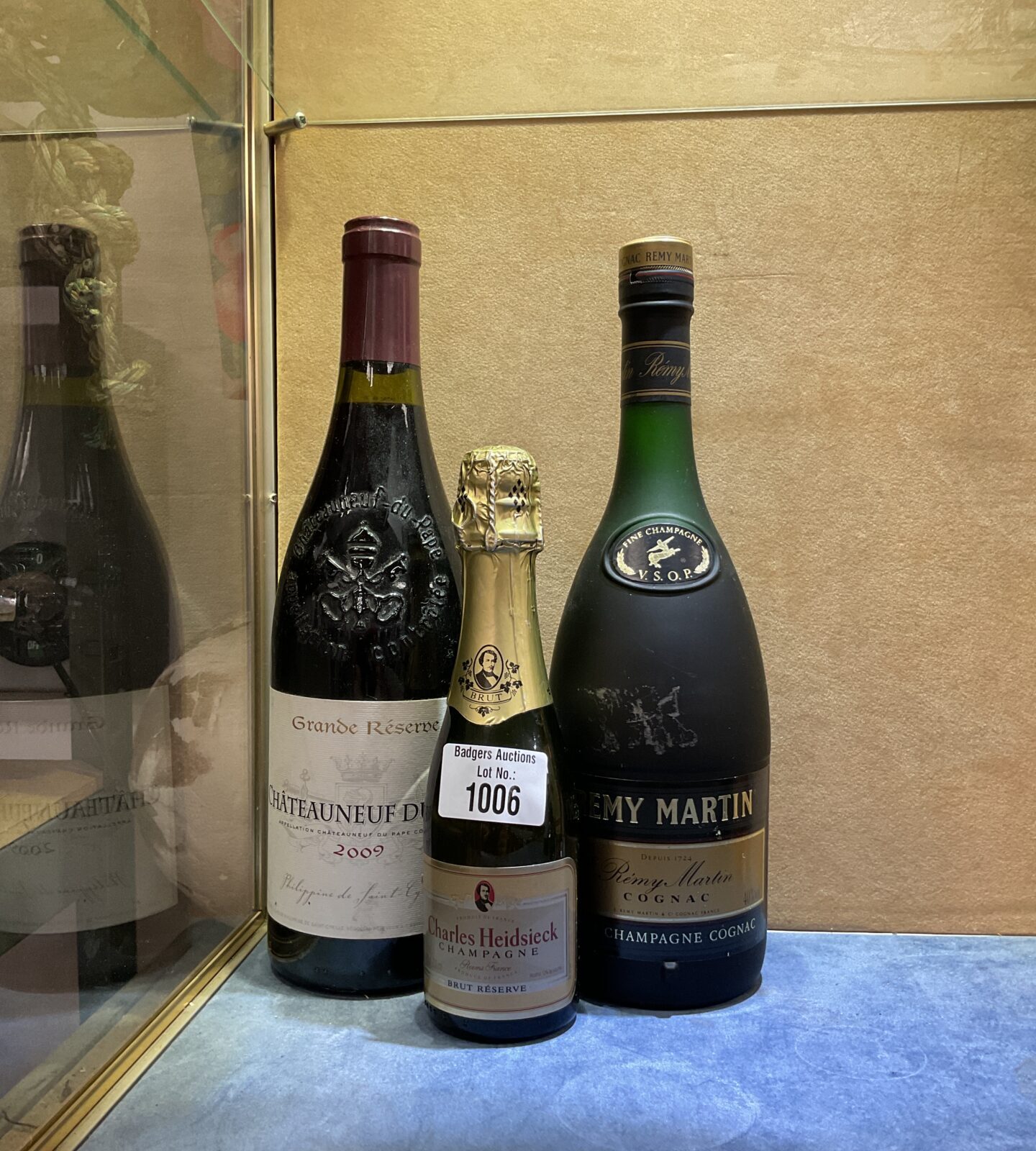 Bottles of remy martin cognac, chateauneuf du pape & charles heidsieck champagne