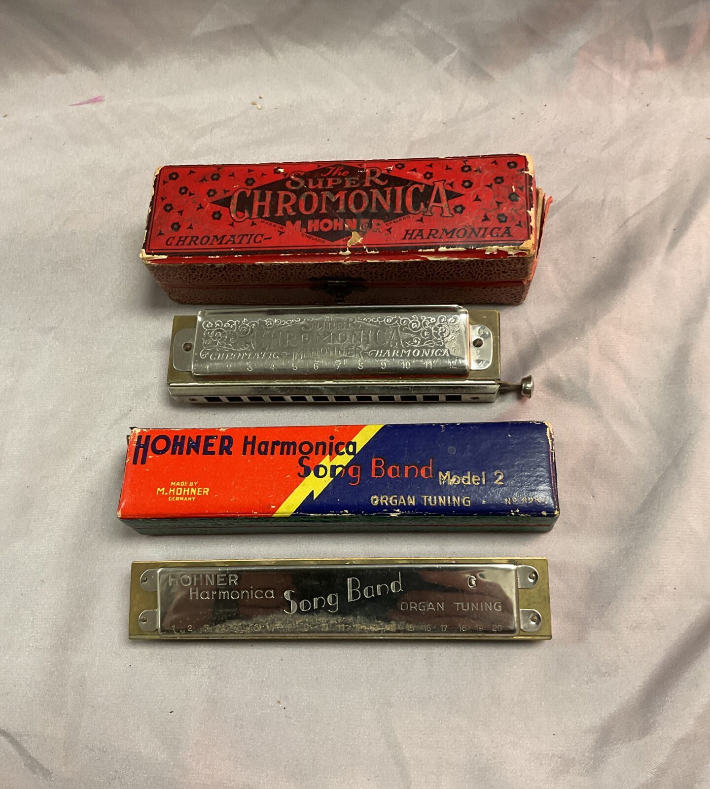 Two Horner harmonicas super chromonica and song bird