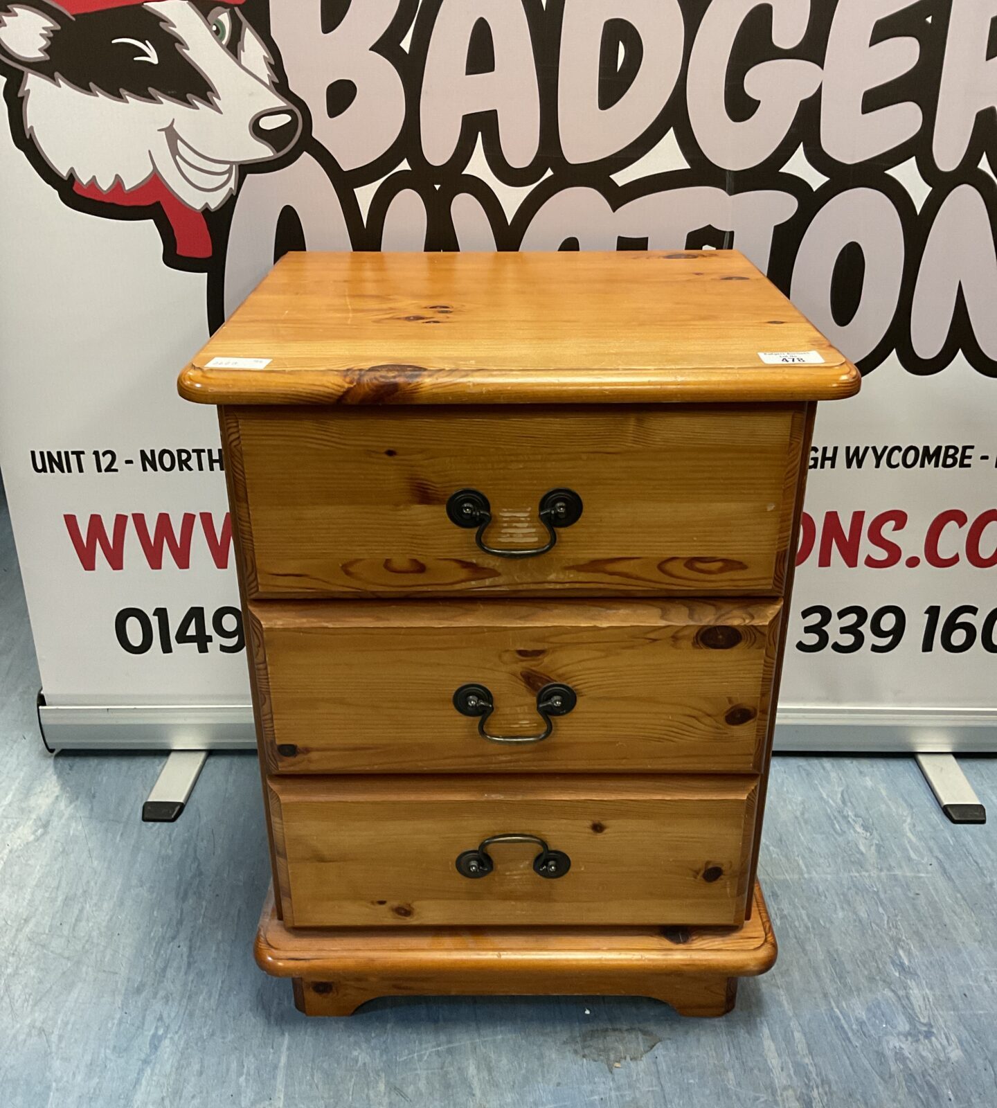 Pine three drawer bedside cabinet