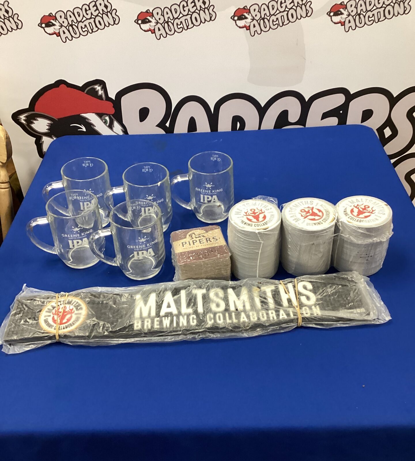 Box of maltmaster beer mats & greene king ale pint glasses with six glass water jugs