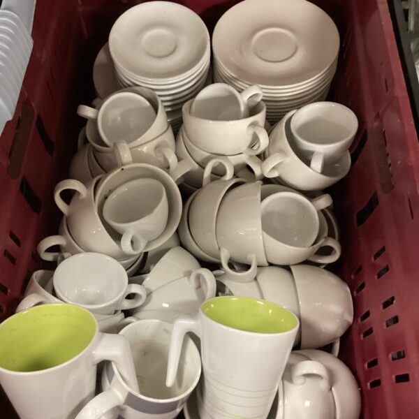 Vintage cups and saucers lot with colourful ceramic designs.
