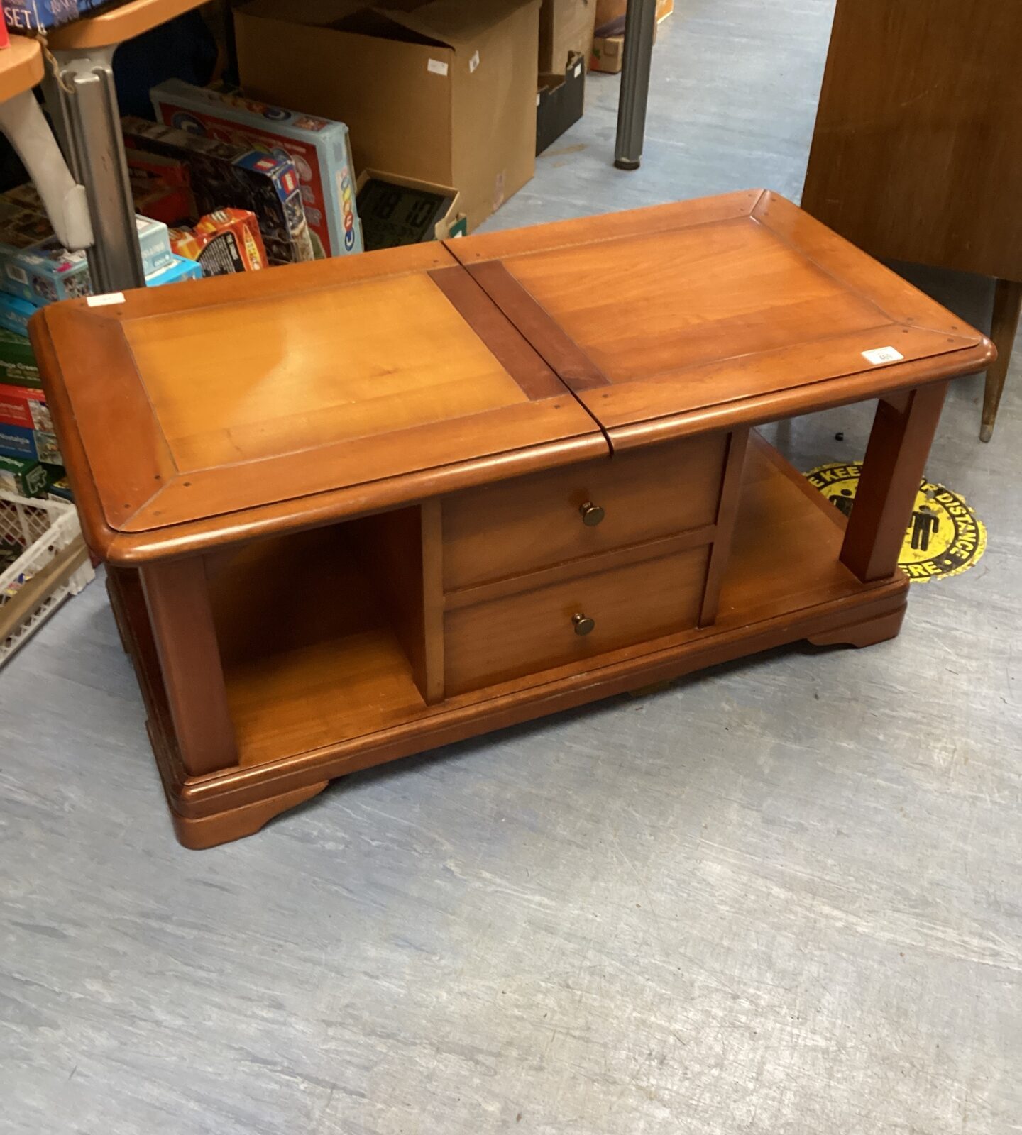 Coffee table with drawers and wheels