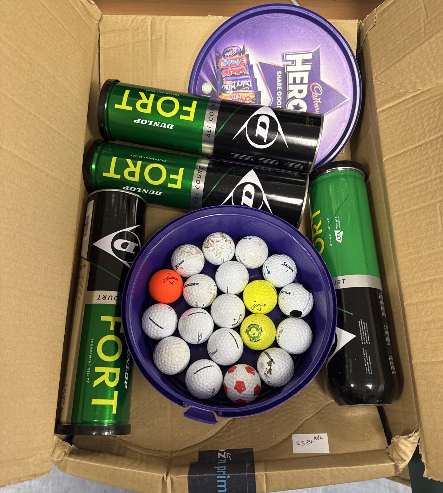 Tub of golf balls & four tins of Dunlop tennis balls