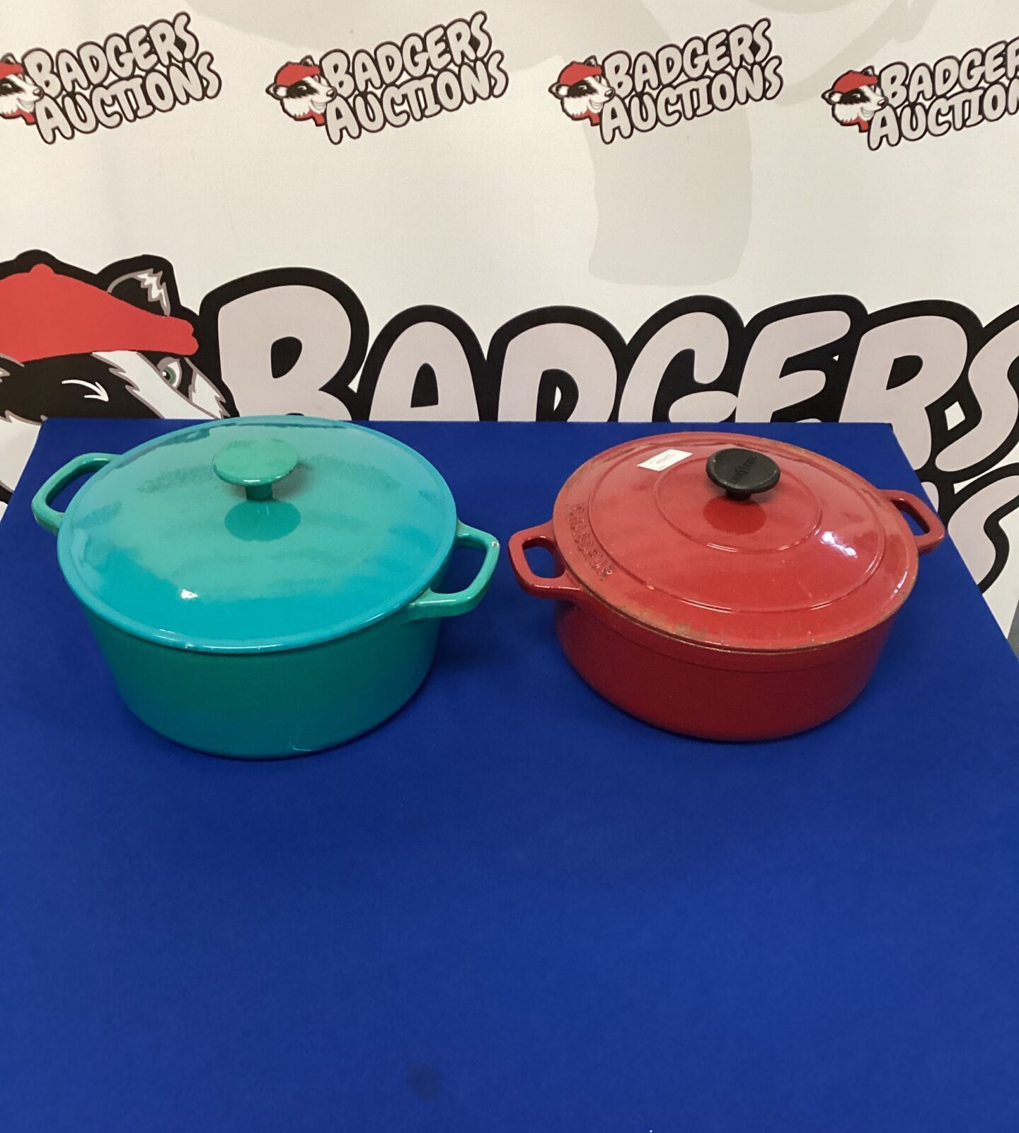 Two wrought iron casserole pots