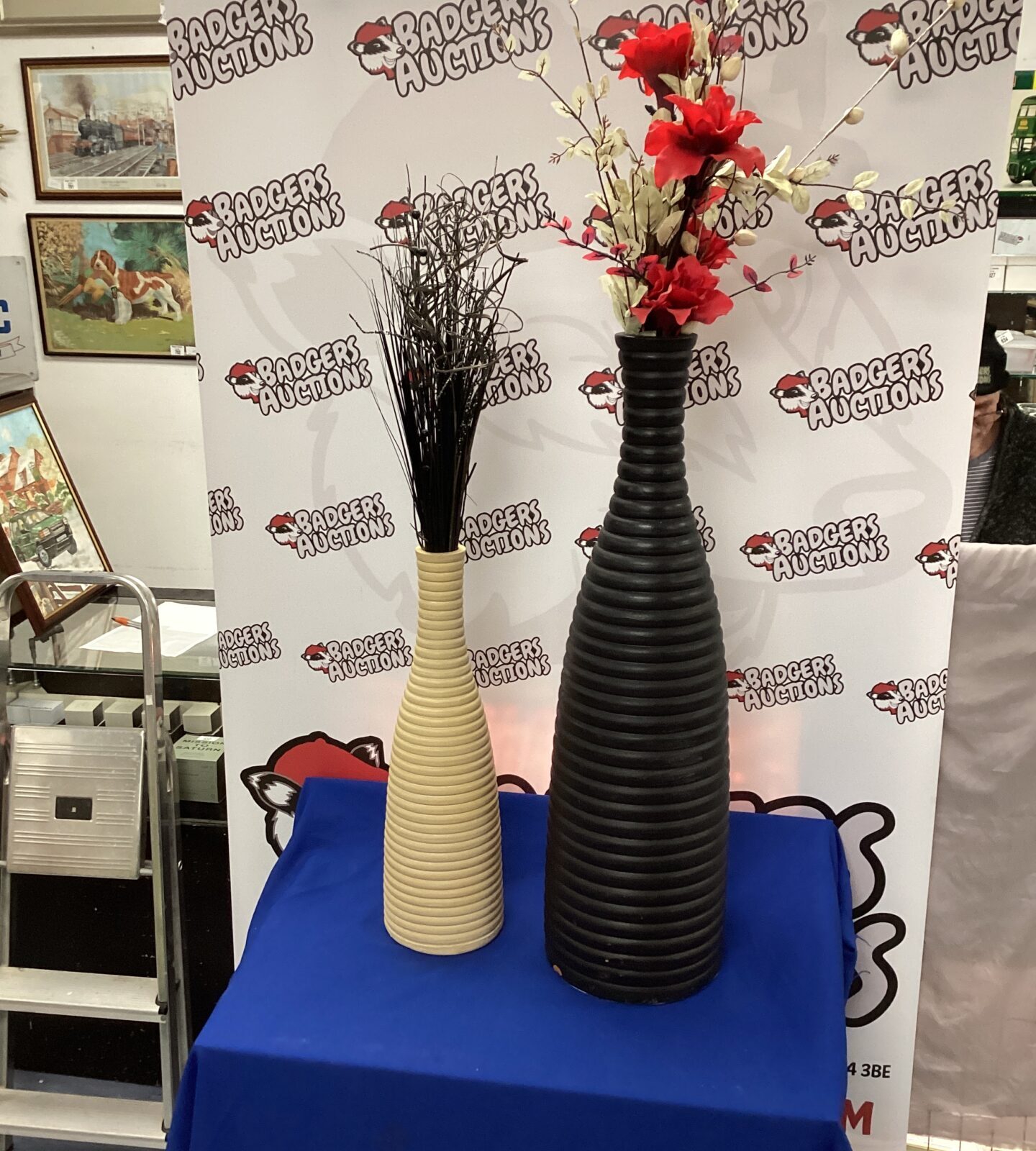 Two tall Pottery Vases with artificial flowers