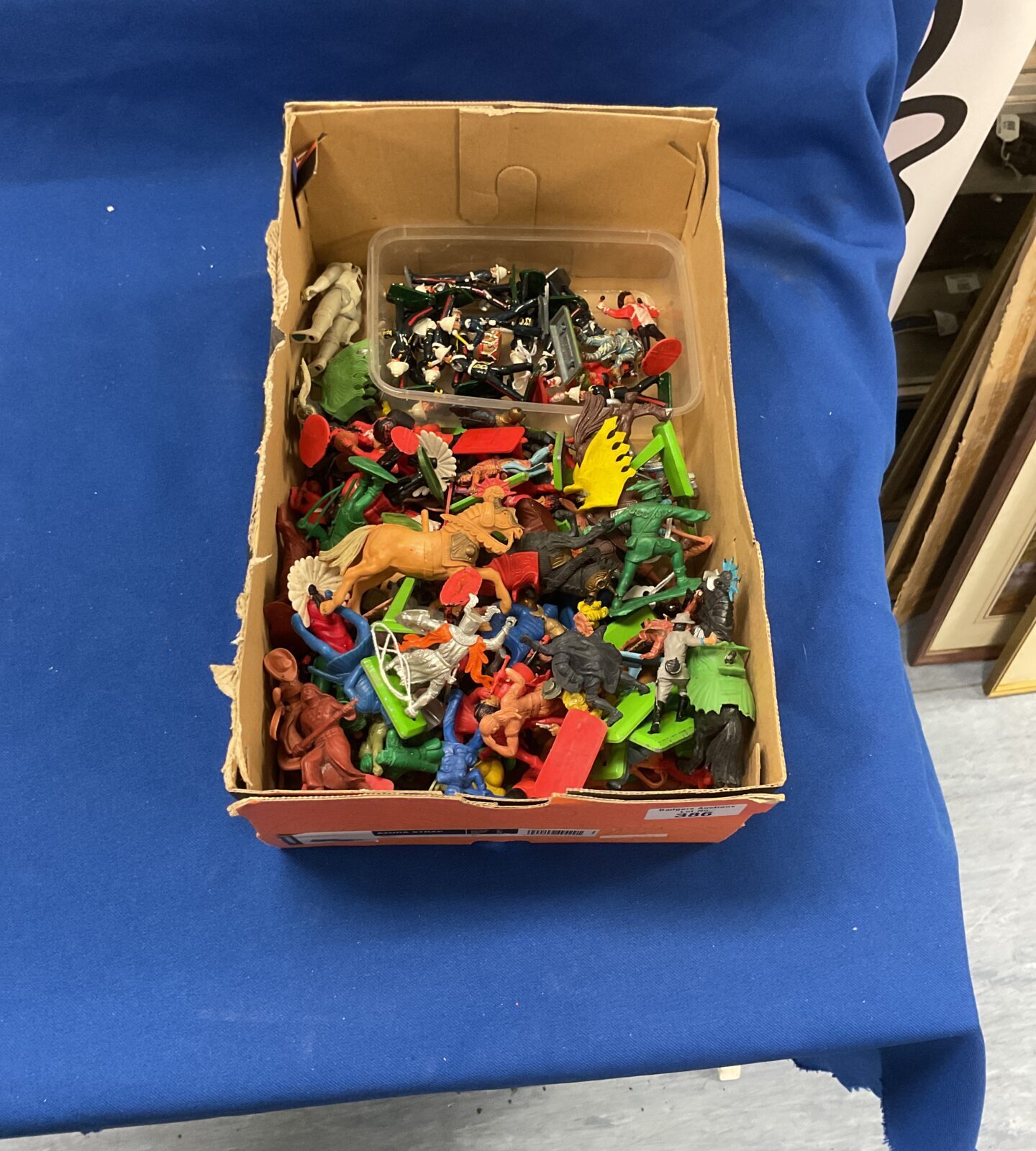 Box of childrens toy soldiers, britains  cowboys, indians and royal marines and marching band