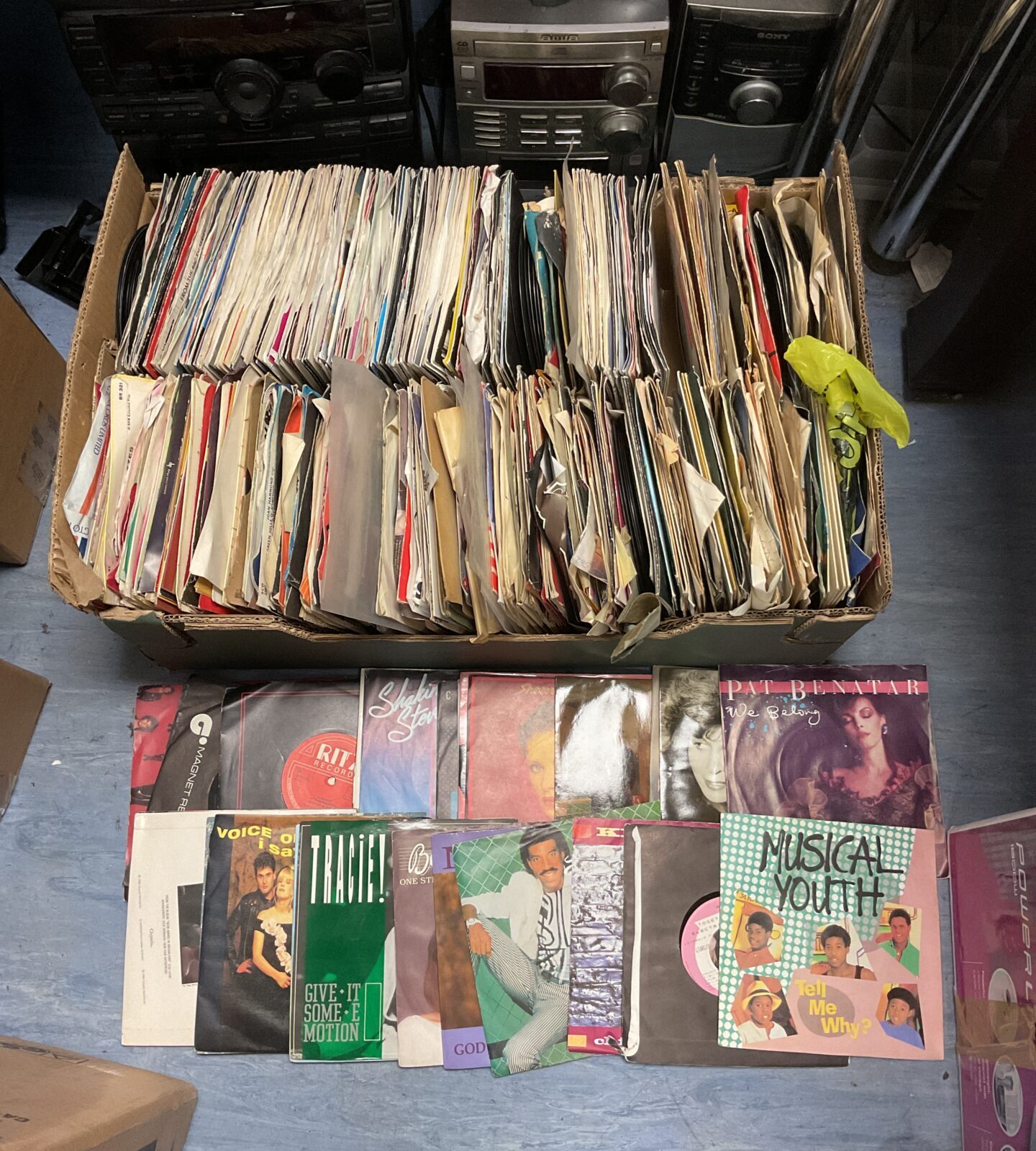 Large tray full of 7” single vinyl records