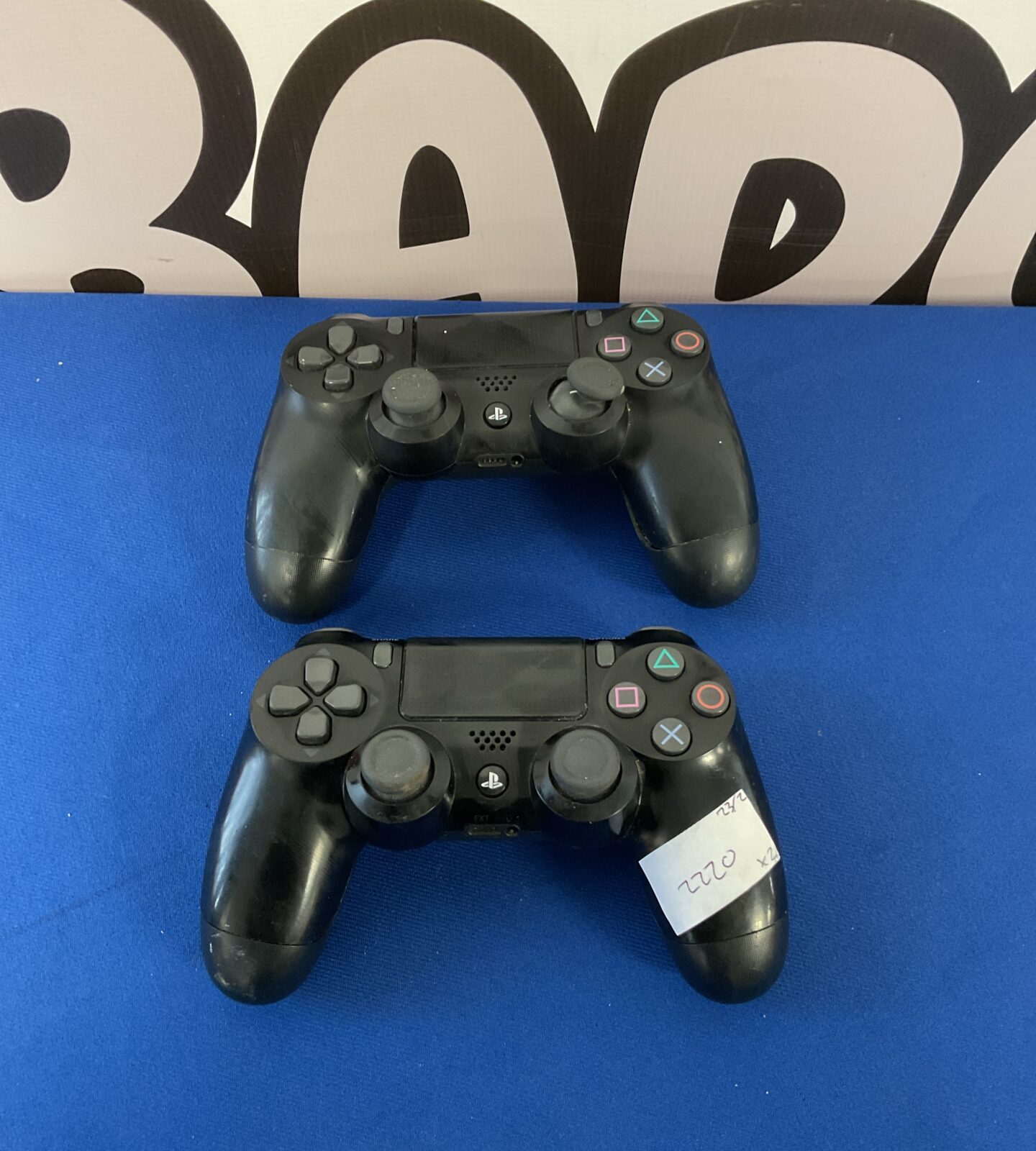 Two sony PlayStation 4 controllers