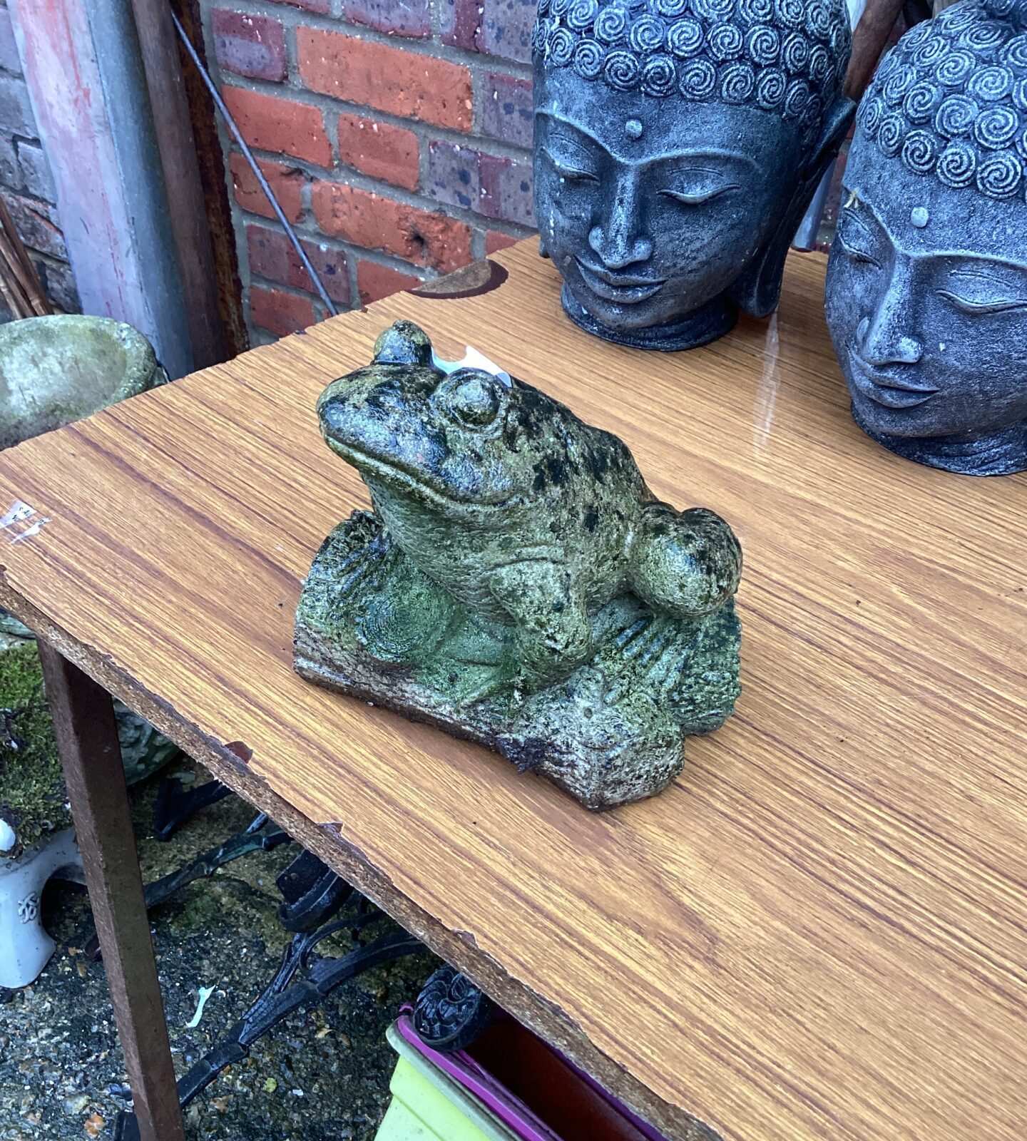 Small stone frog garden ornament