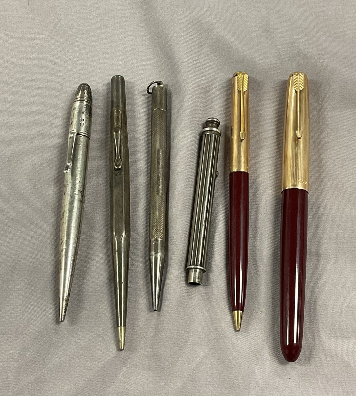 Three Sterling silver propelling Pencil and two Parker pens