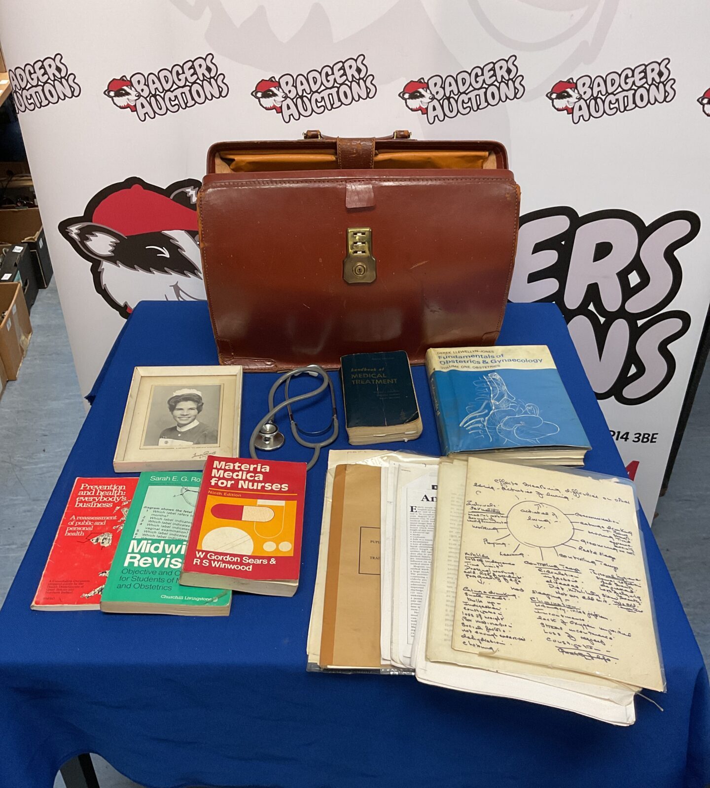 Vintage leather doctors bag filled with midwifery books & ephemera