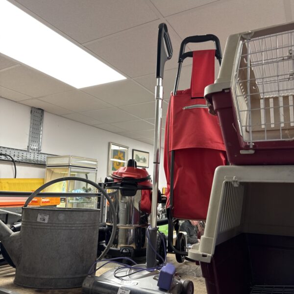 Red Gtech cordless vacuum cleaner, untested with flat battery.
