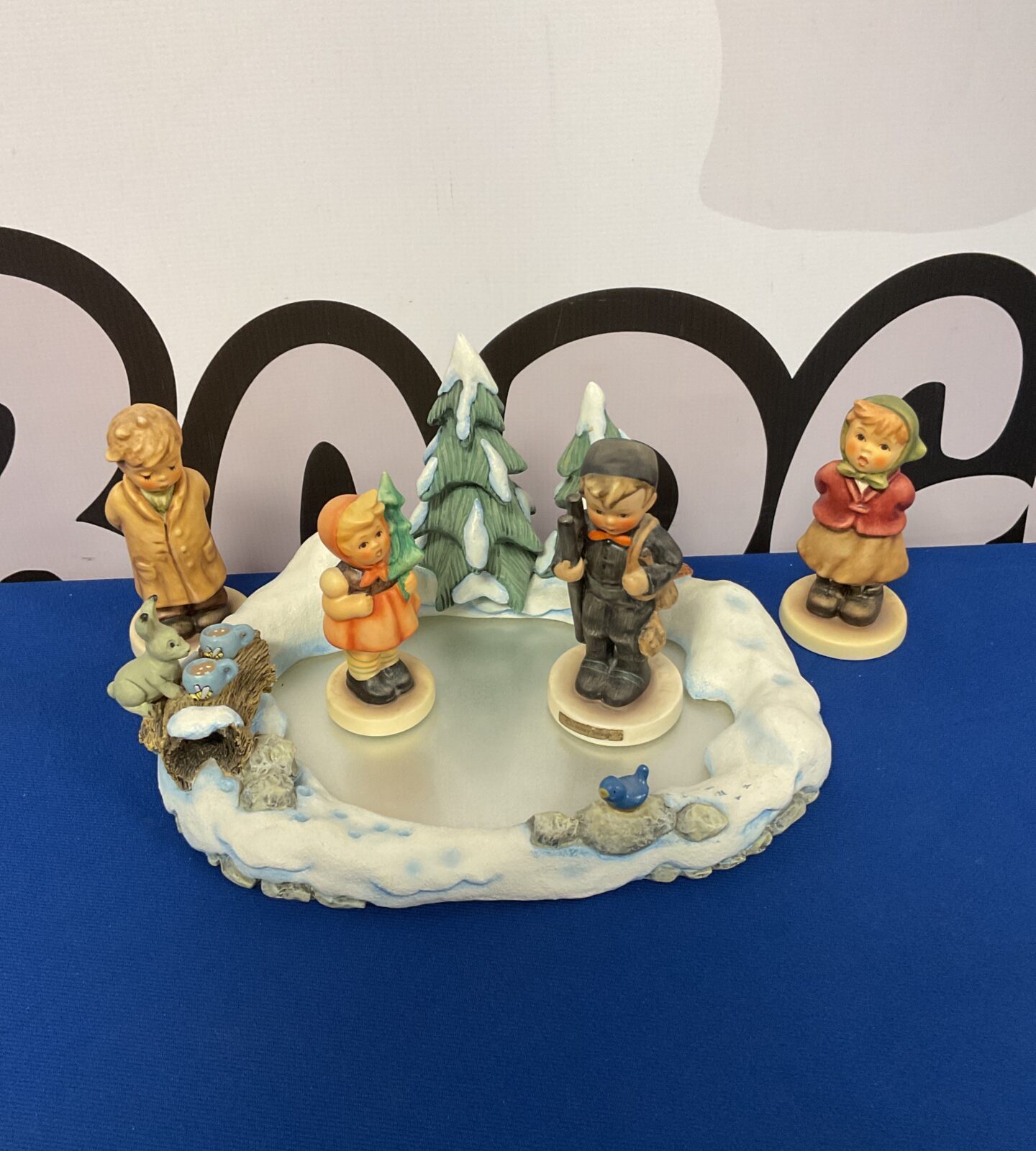 Goebel hummel icy adventure with figures including chimney sweep