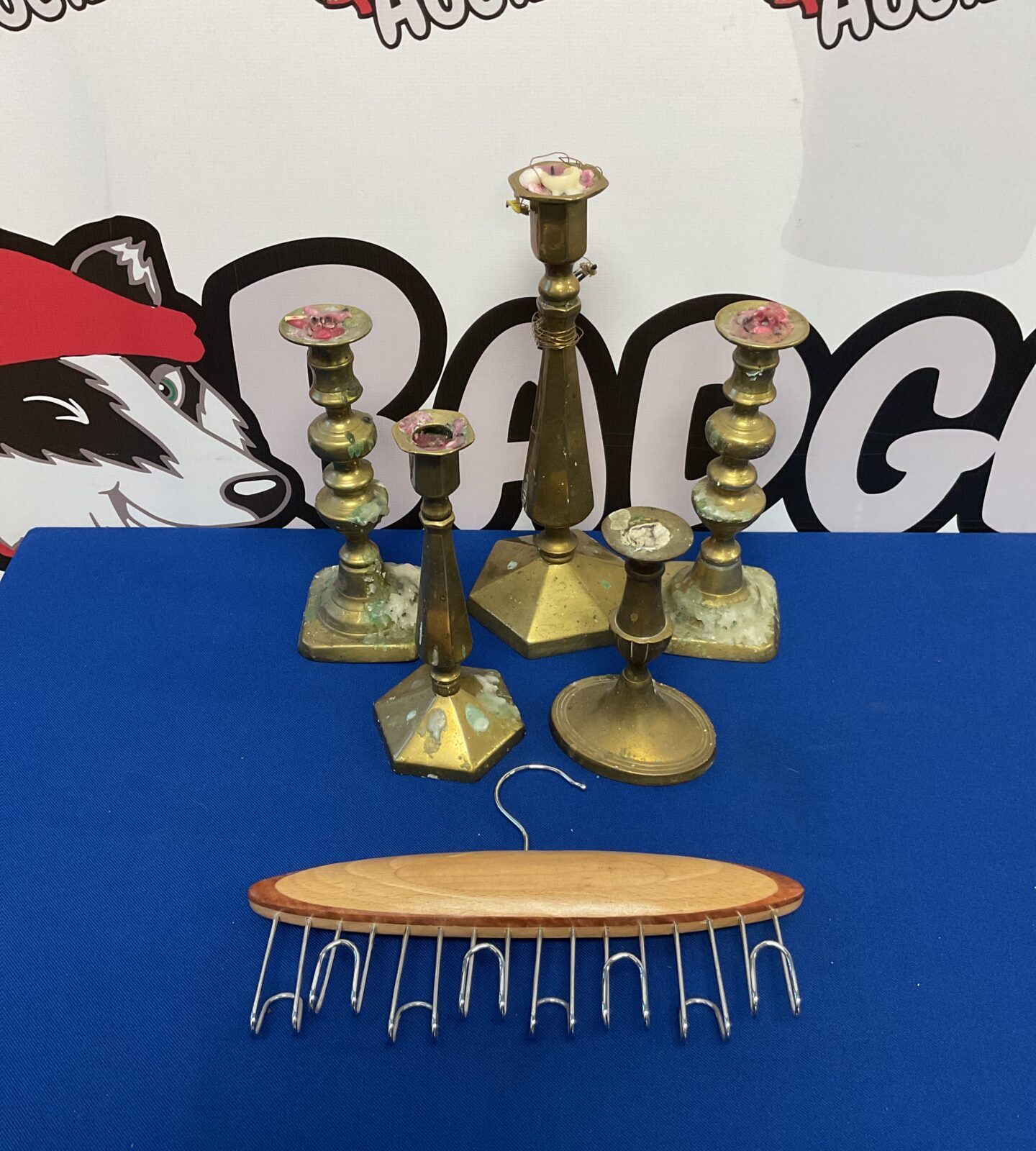 Selection of brass candlesticks & nat wood belt rack