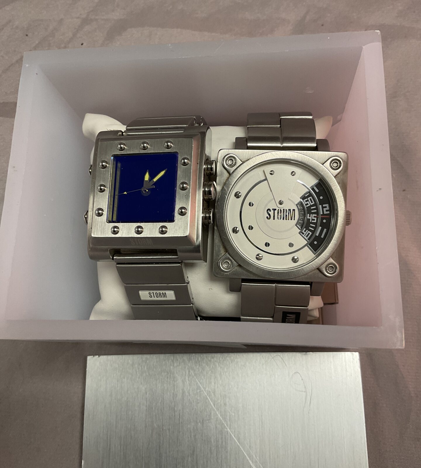 two storm Quartz watches