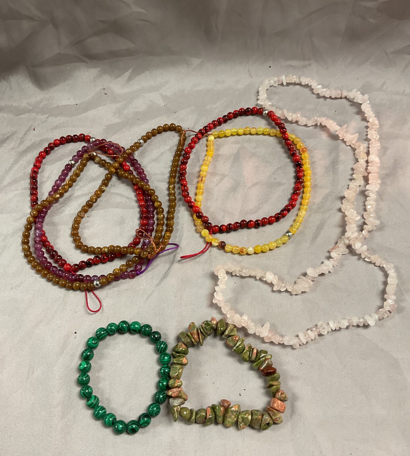 Collection of stone bracelets and necklaces