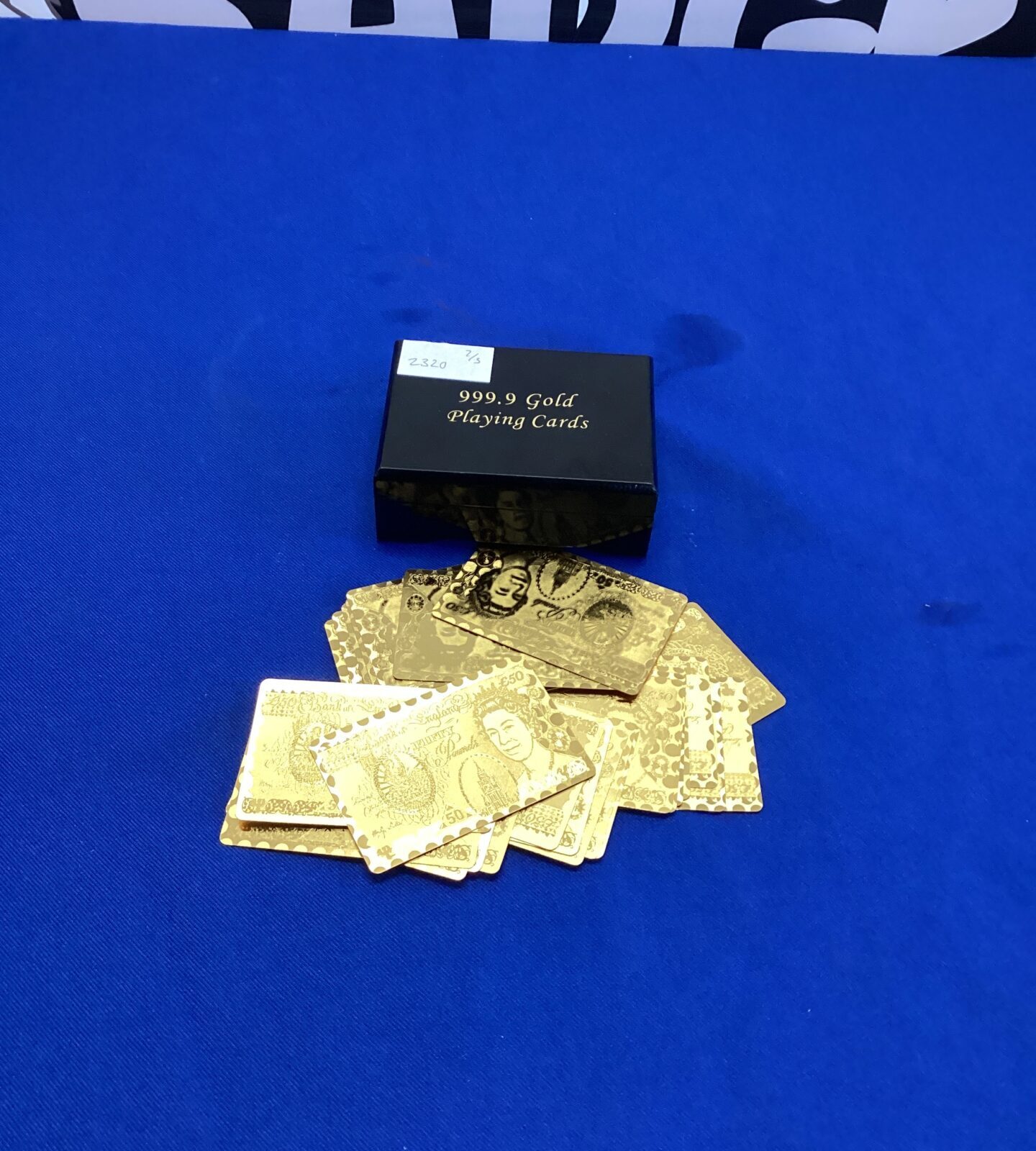 Pack of gold coloured money playing cards with box