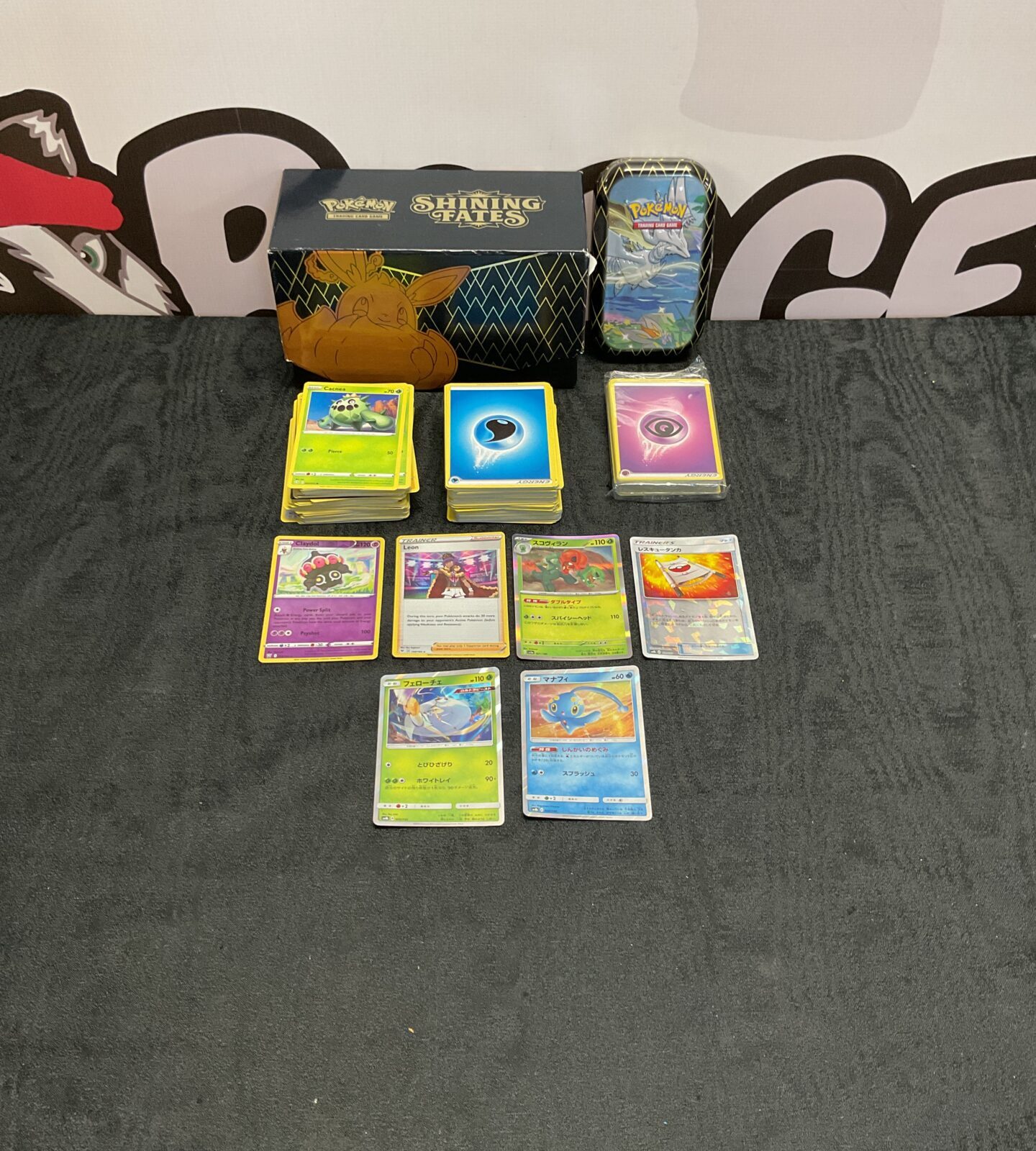 Collection of mixed Pokemon cards inc holos and tin