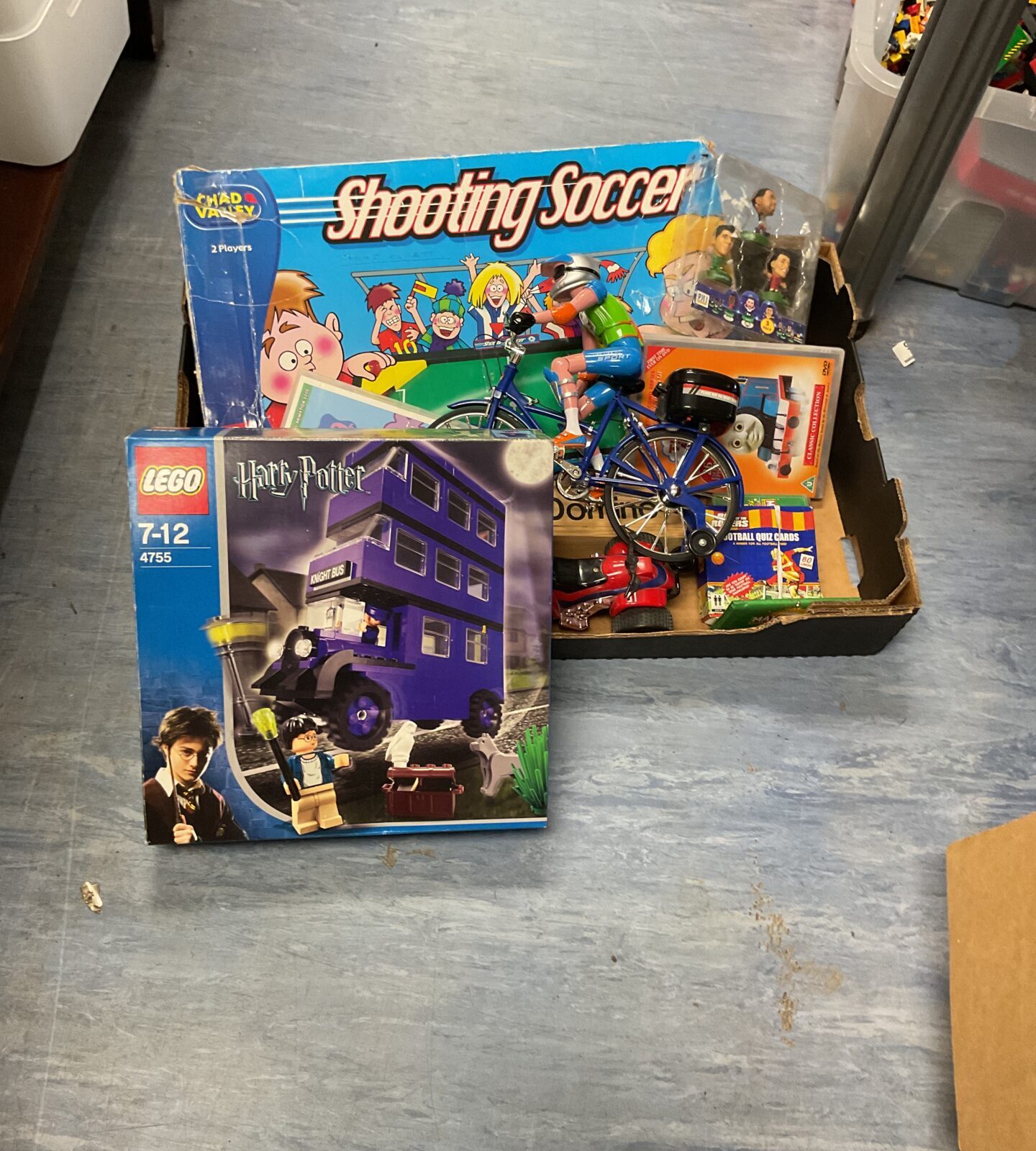 Box of mixed toys inc Lego harry potter set, shooting soccer game and others