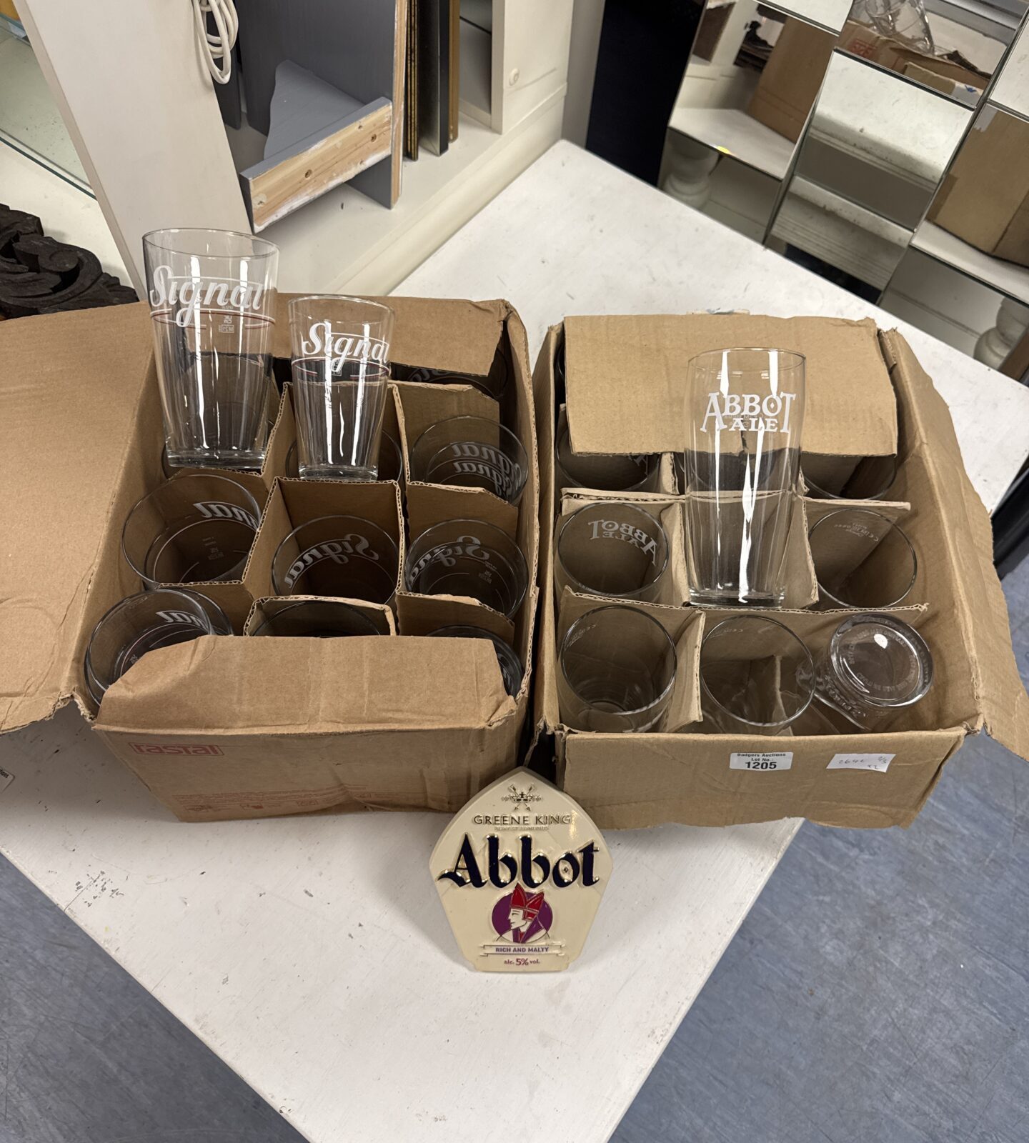 Box of abbot ale pint glasses & pump sign with box of signal pint & half pint glasses