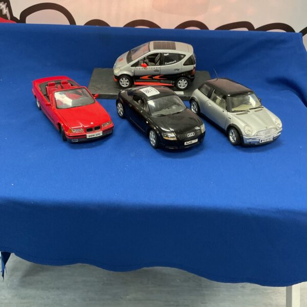 Four diecast models inc solido, revell and maisto