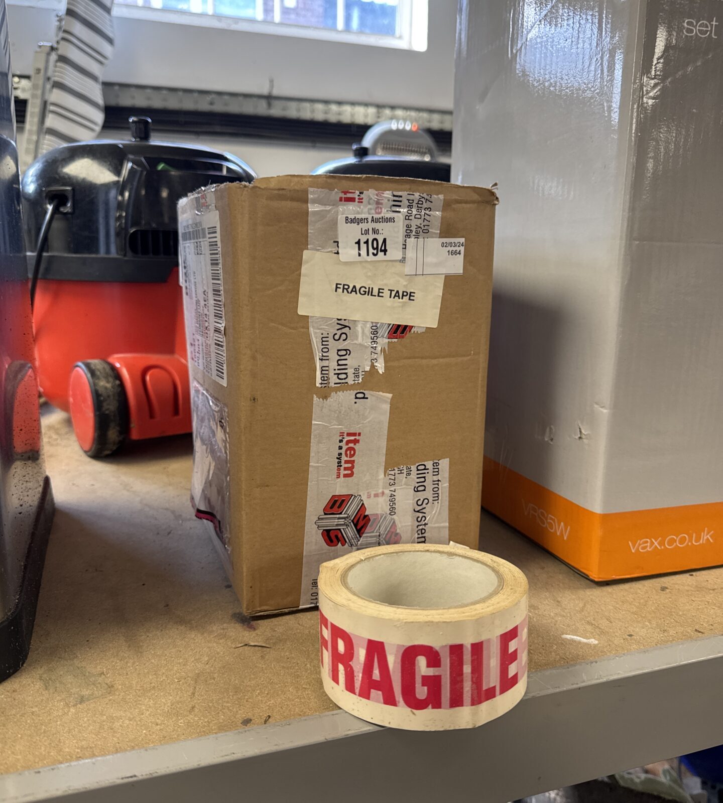 Small box of fragile tape rolls