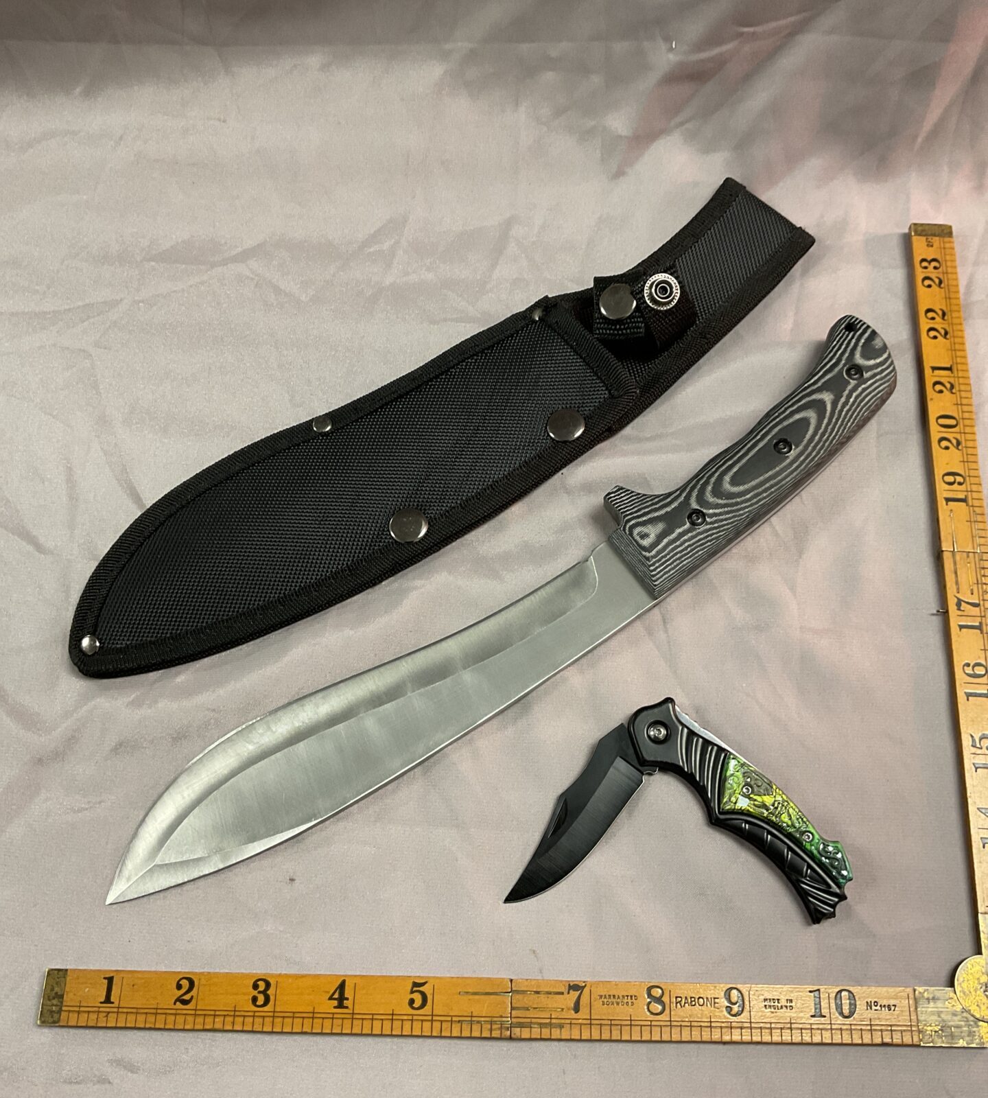 Sheath knife and a pocket knife