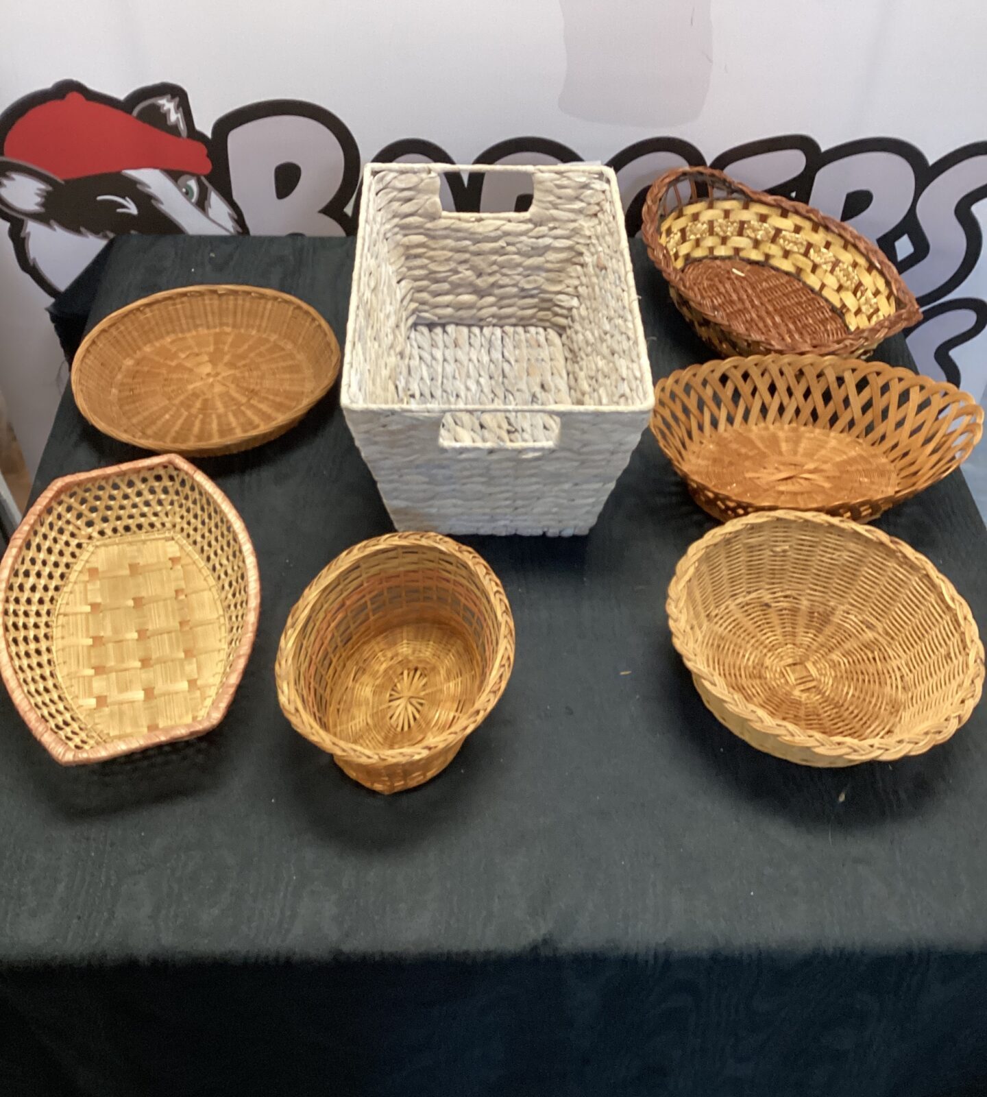 Seven small wicker baskets