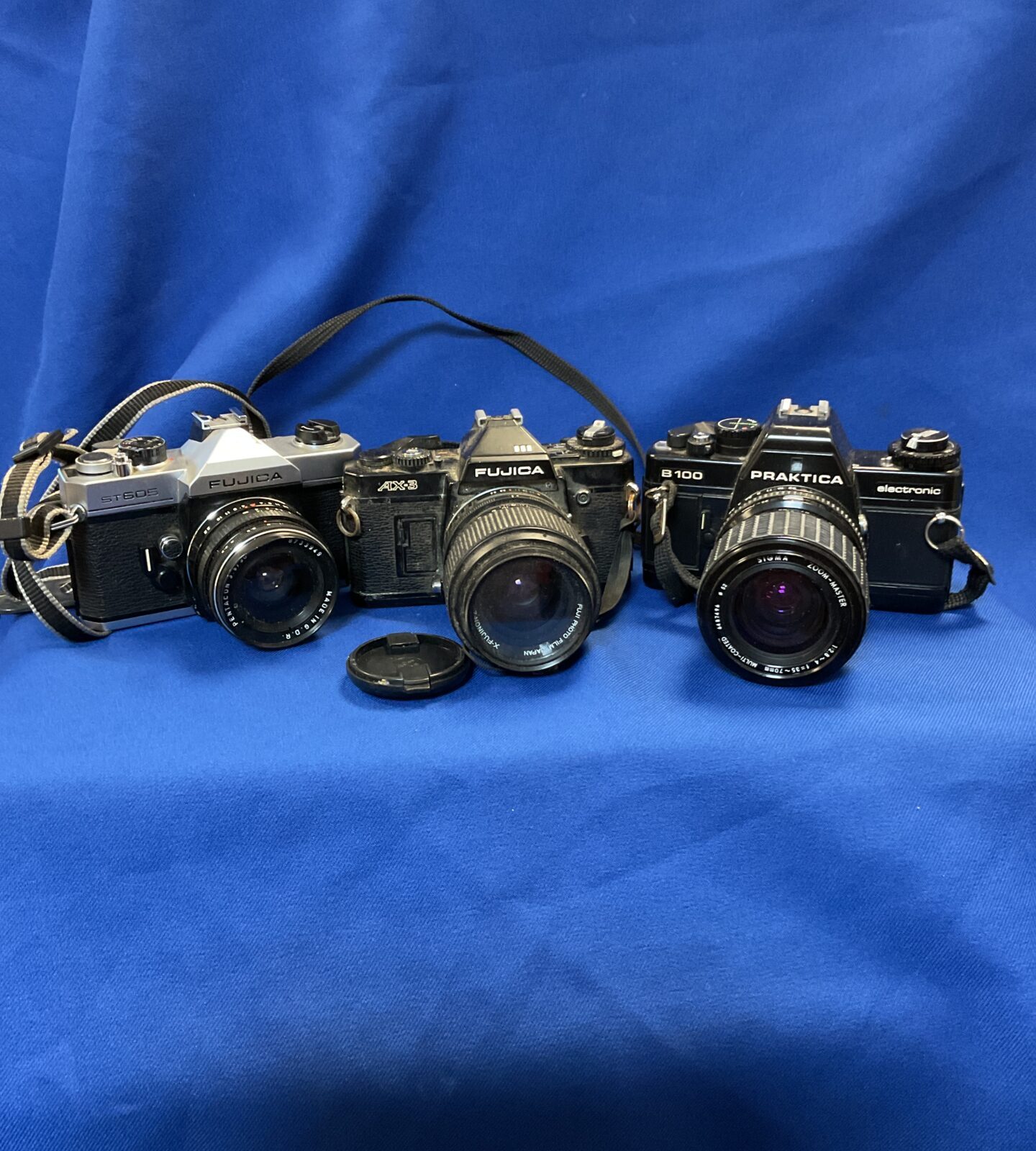 Three film cameras including fuica ax-3 & st605 & praktika b100