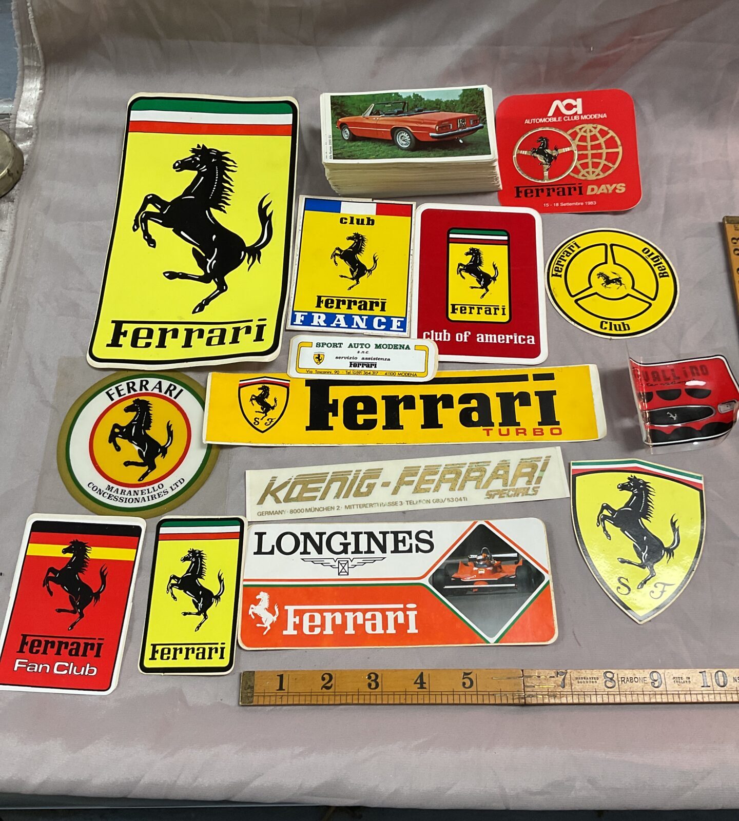 Collection of vintage 1960s Ferrari stickers and a set of vintage car cards