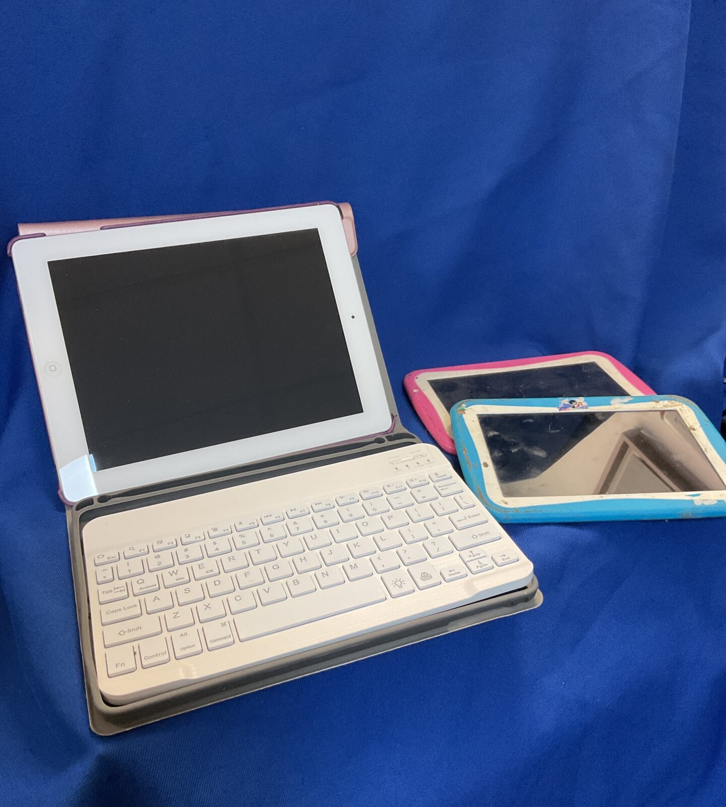 Three tablet computers including apple ipad