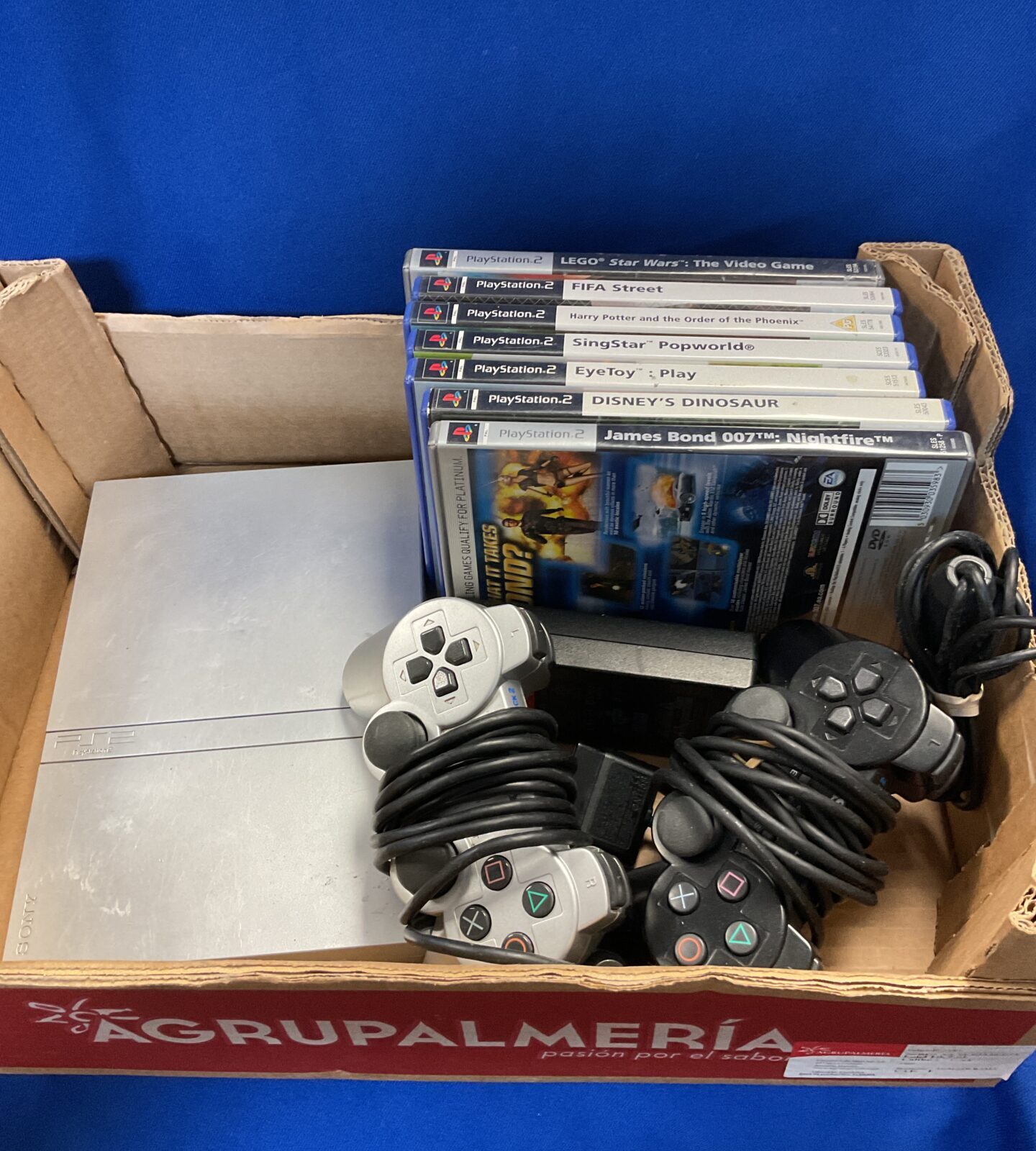 Silver sony PlayStation 2 slim console with games
