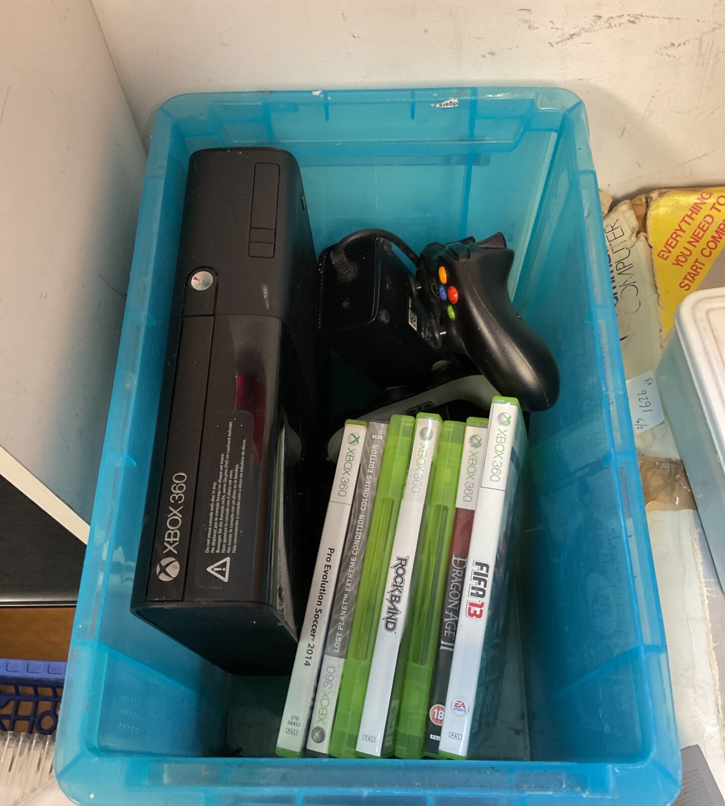 Microsoft xbox 360 e console with controllers & games