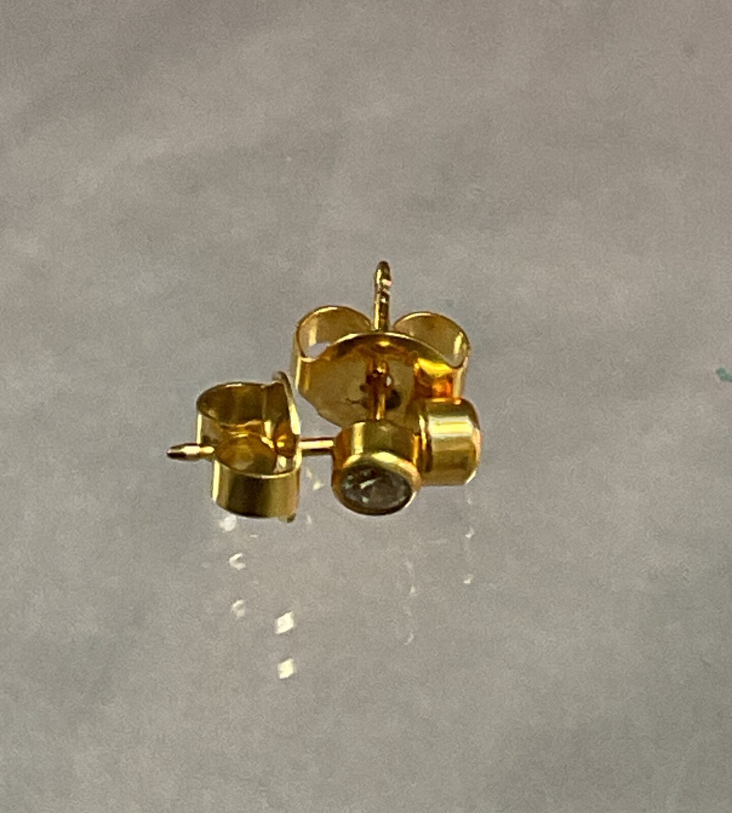 Pair of 9ct gold white stone stud earrings